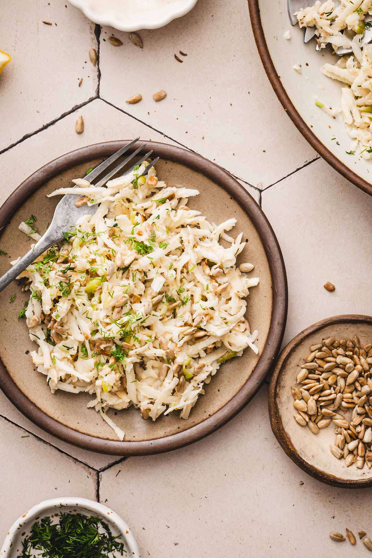 finished salad on a serving plate, dish with sunflower seeds