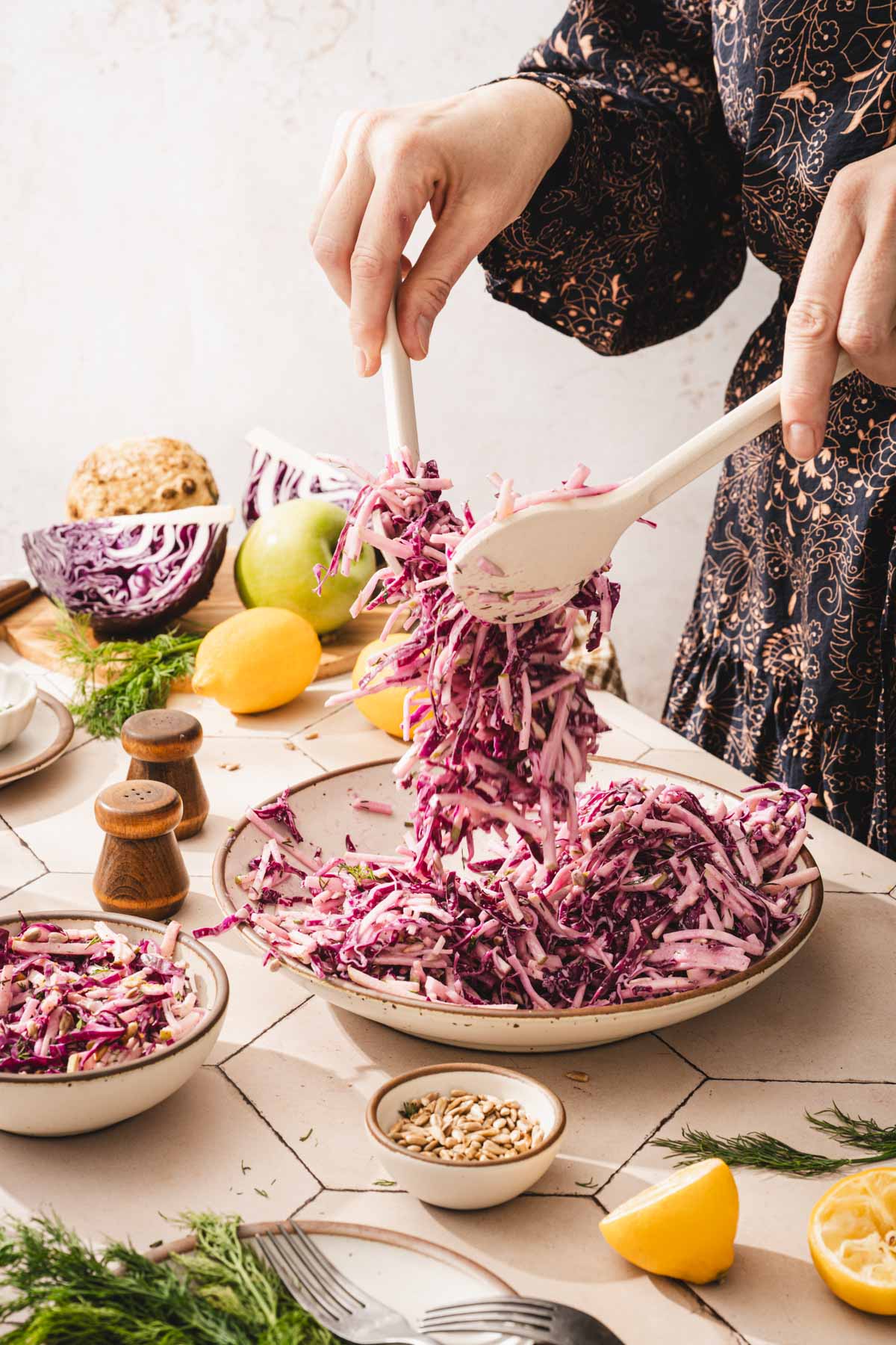 hands in frame tossing the salad