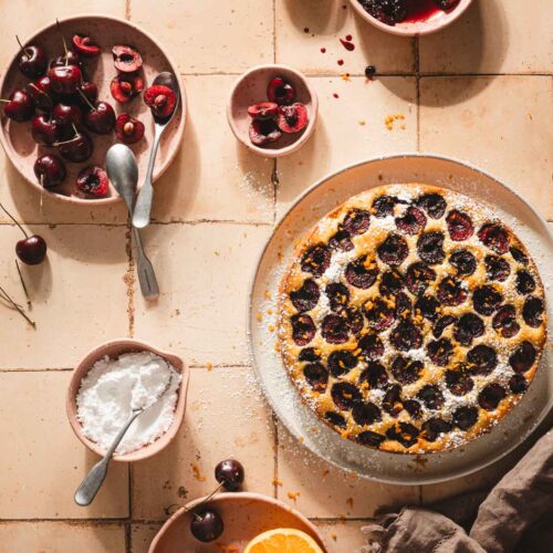 cherry biszkopt on a serving platter, fresh cherries, sugar