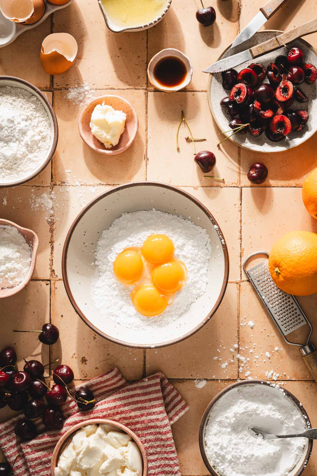 egg yolks added to the bowl with powdered sugar