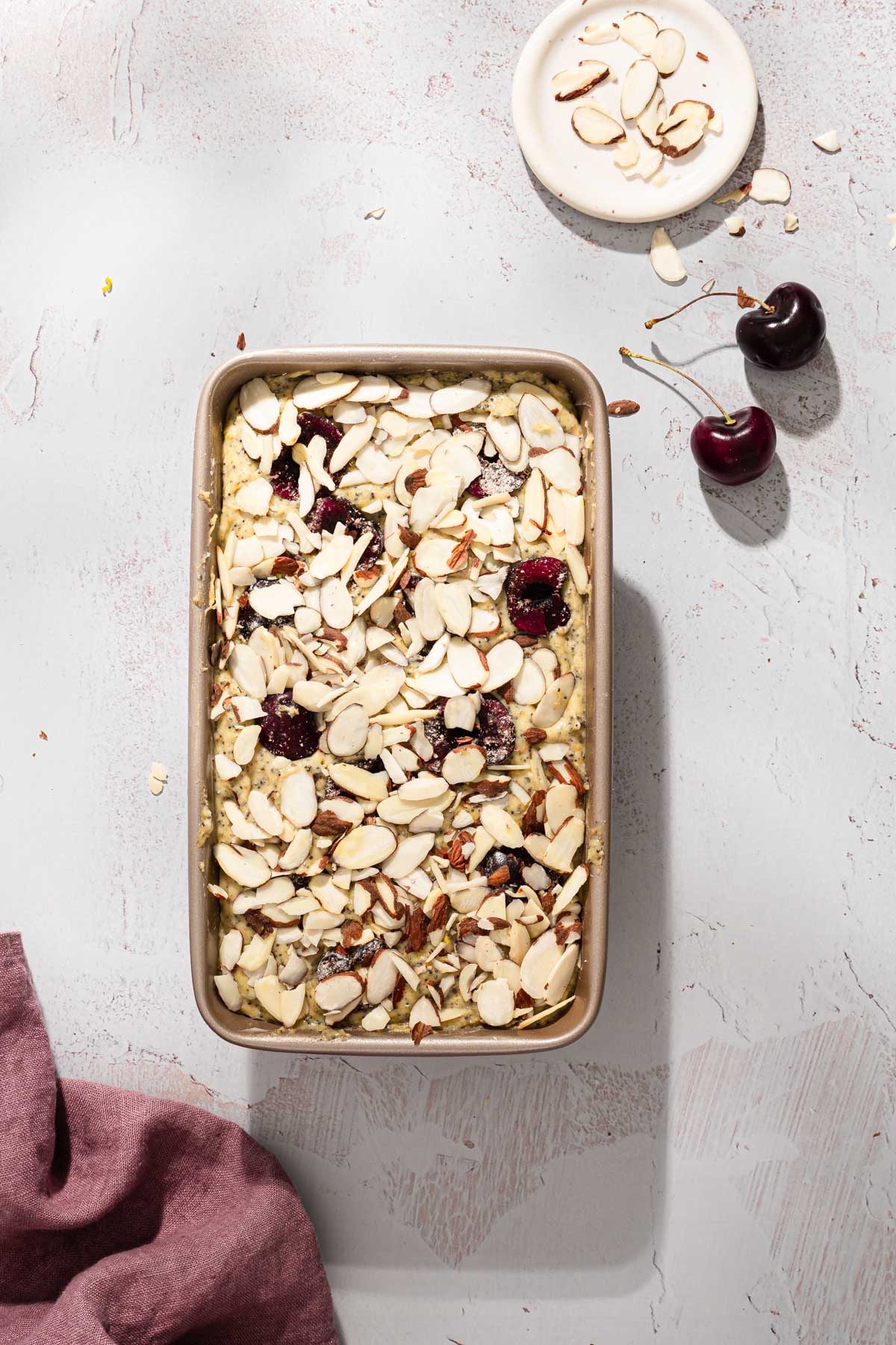 raw cherry bread in a baking pan