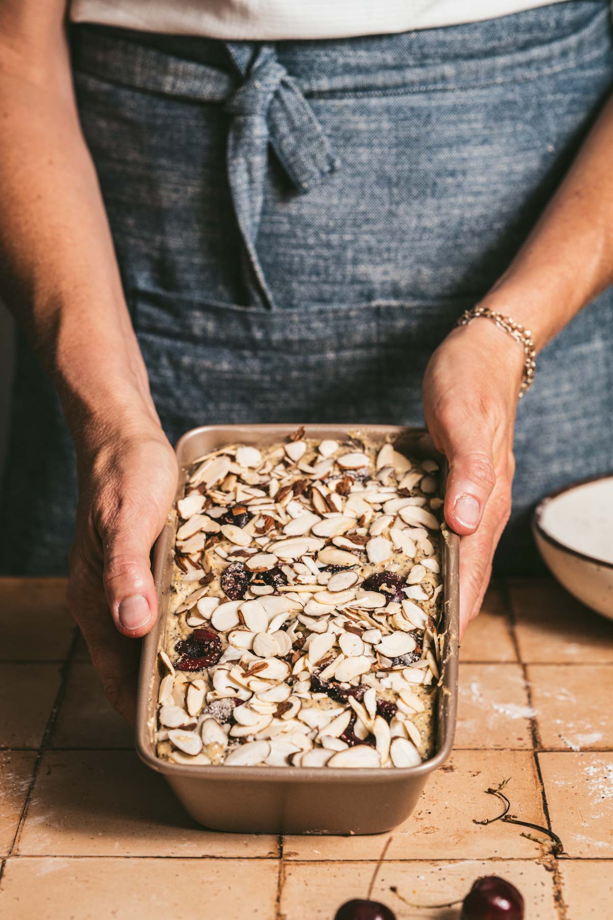 hands in frame holding baking pan