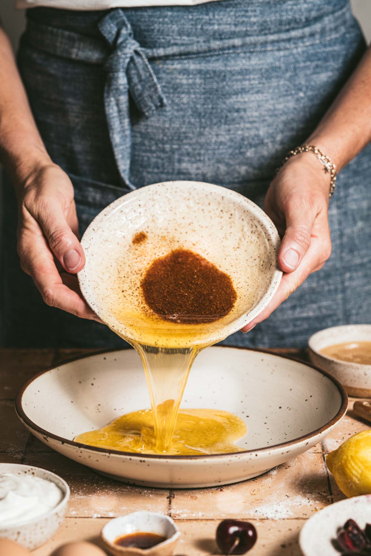 hands in frame adding browned butter