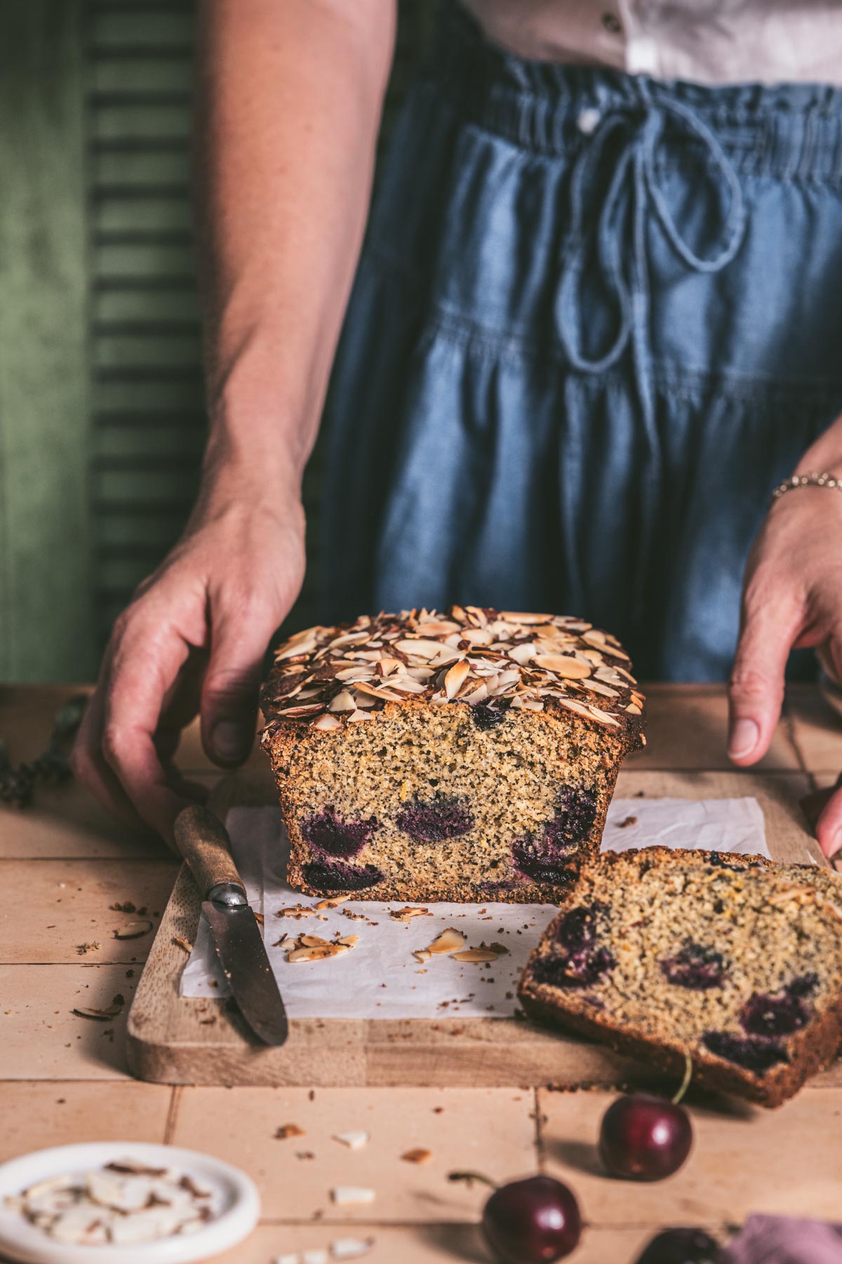 hands in frame holding baked bread