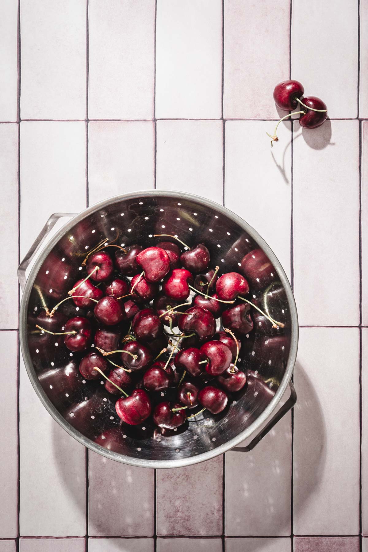 cherries in a strainer