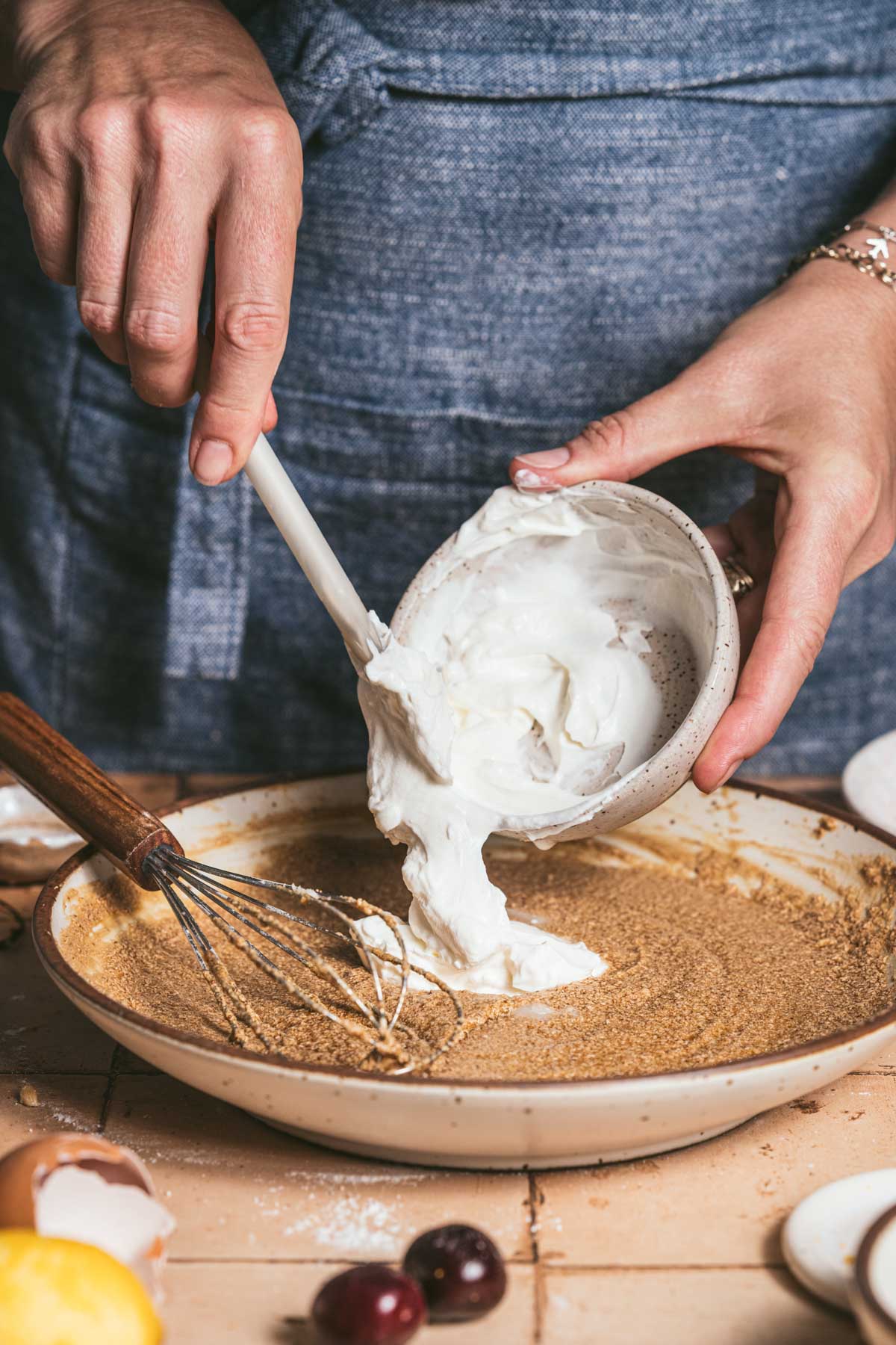 hands in frame adding sour cream