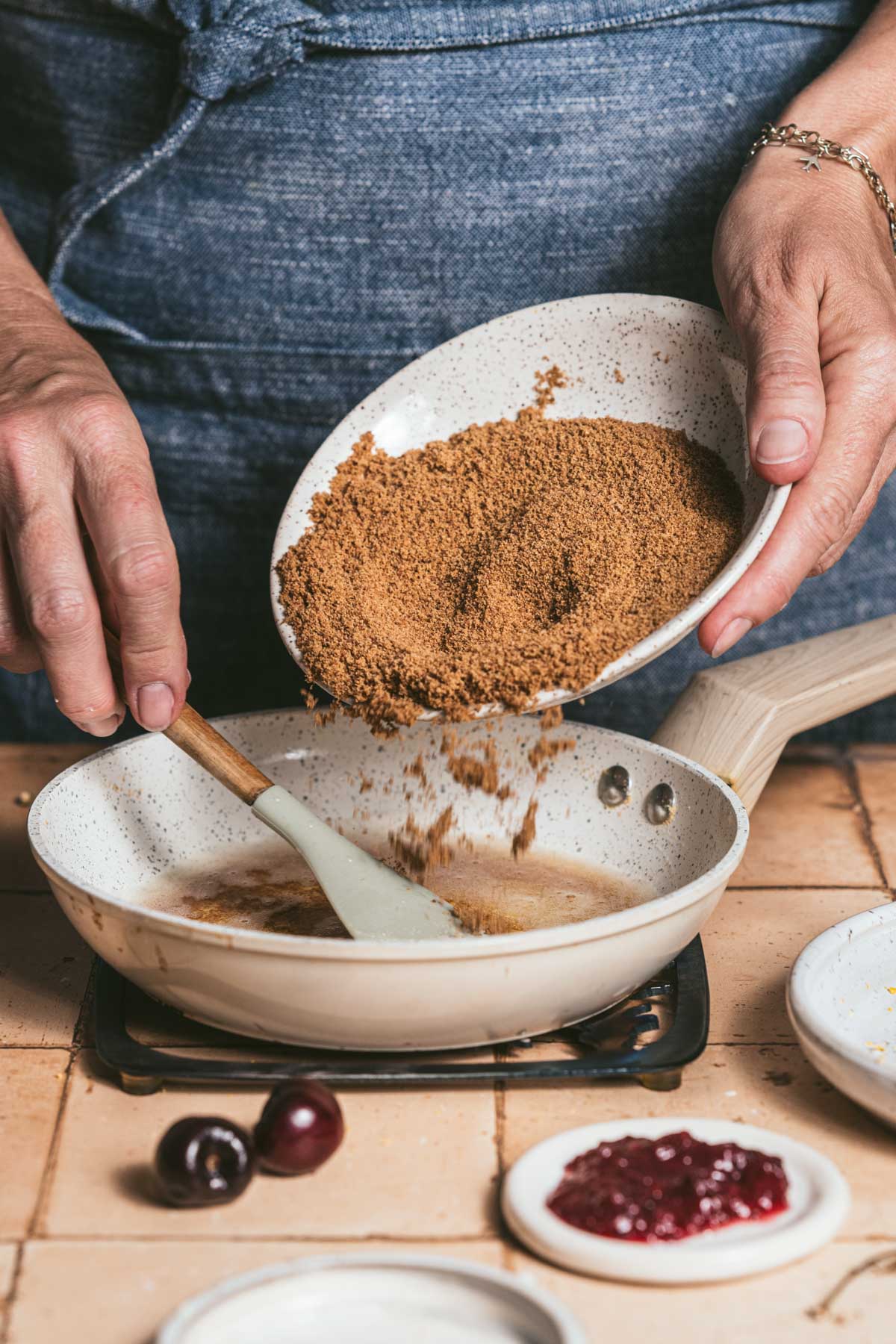 hands in frame holding bowl with coconut sugar