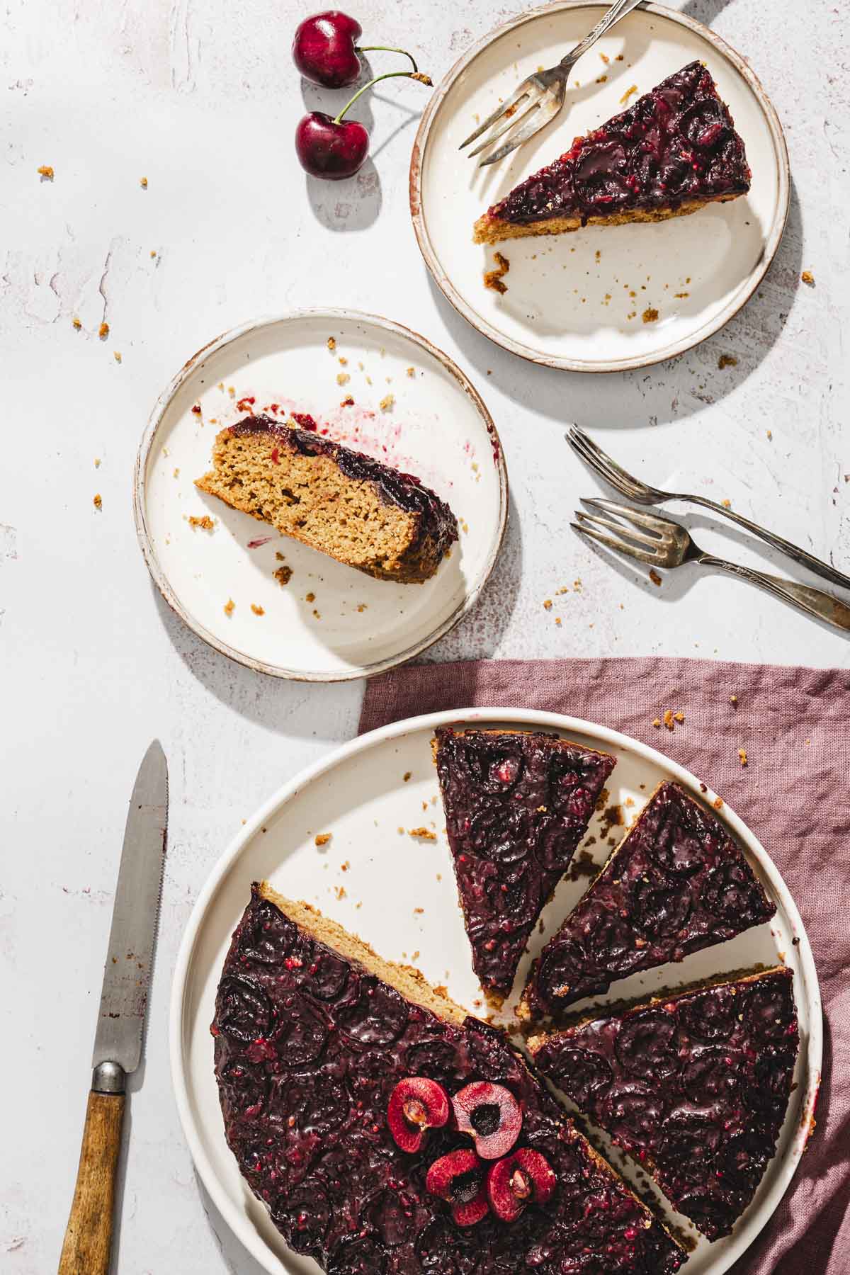 slices of cherry cake on serving plates