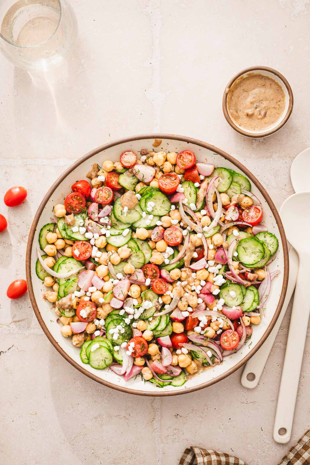top view of a large bowl wiht the salad, jar with mustard