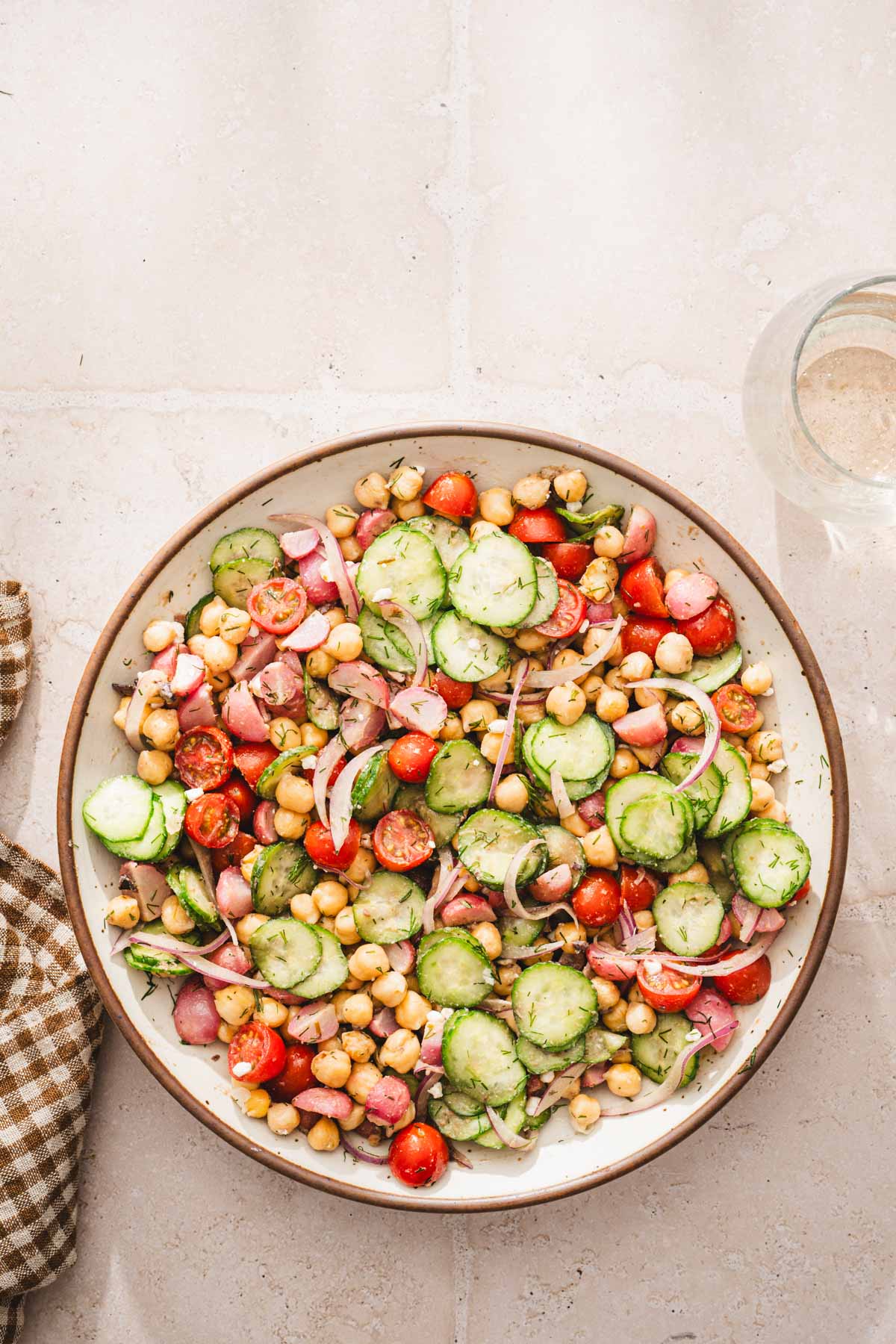 large bowl, glass with drink, brown napkin