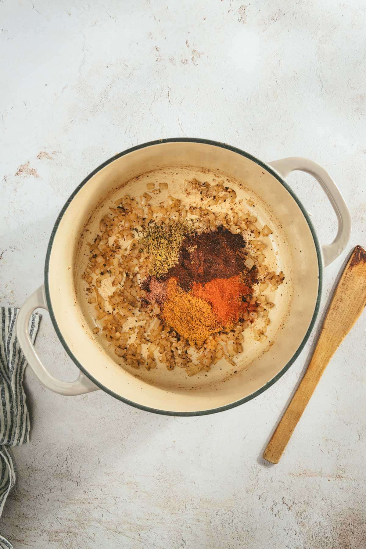 large cooking pot with sautéed onions and spices