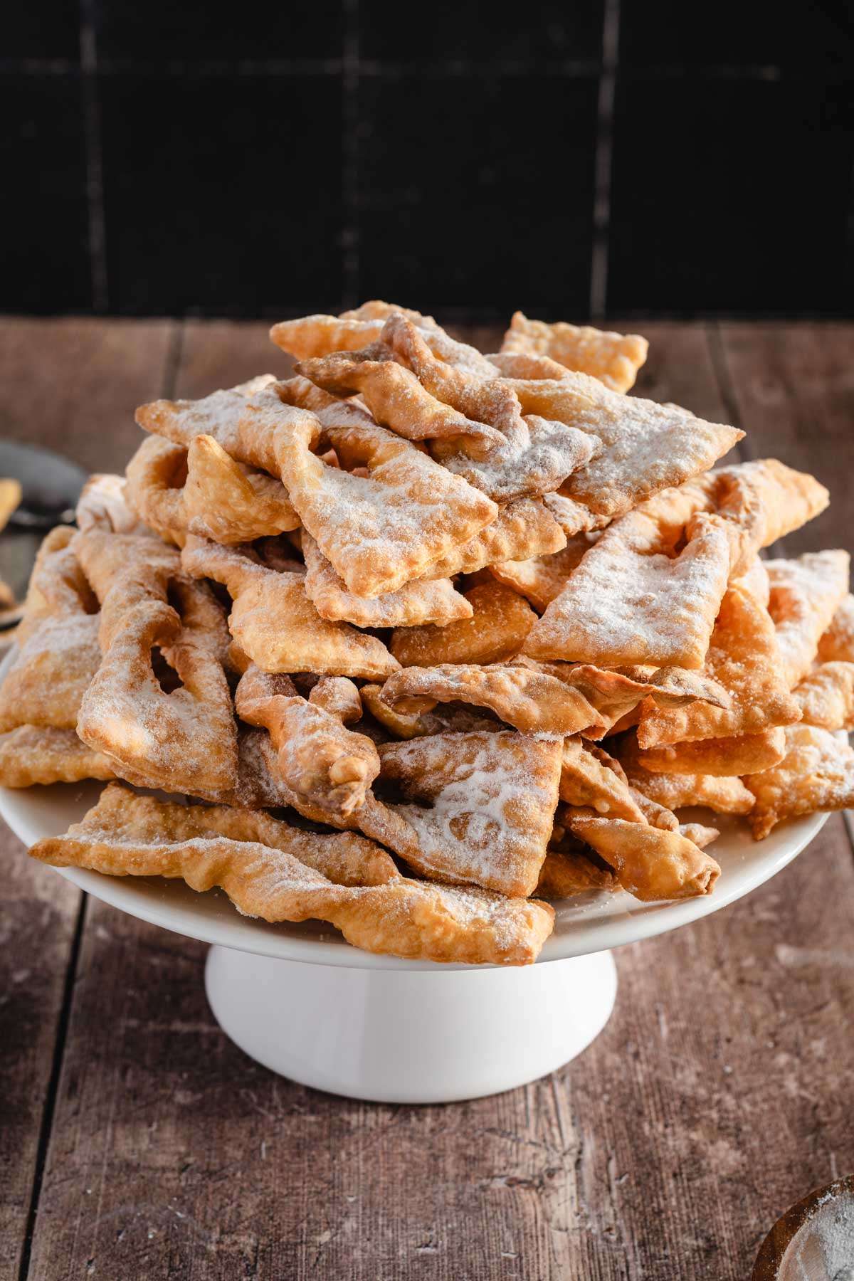 cooked chrusciki on a cake stand, front view