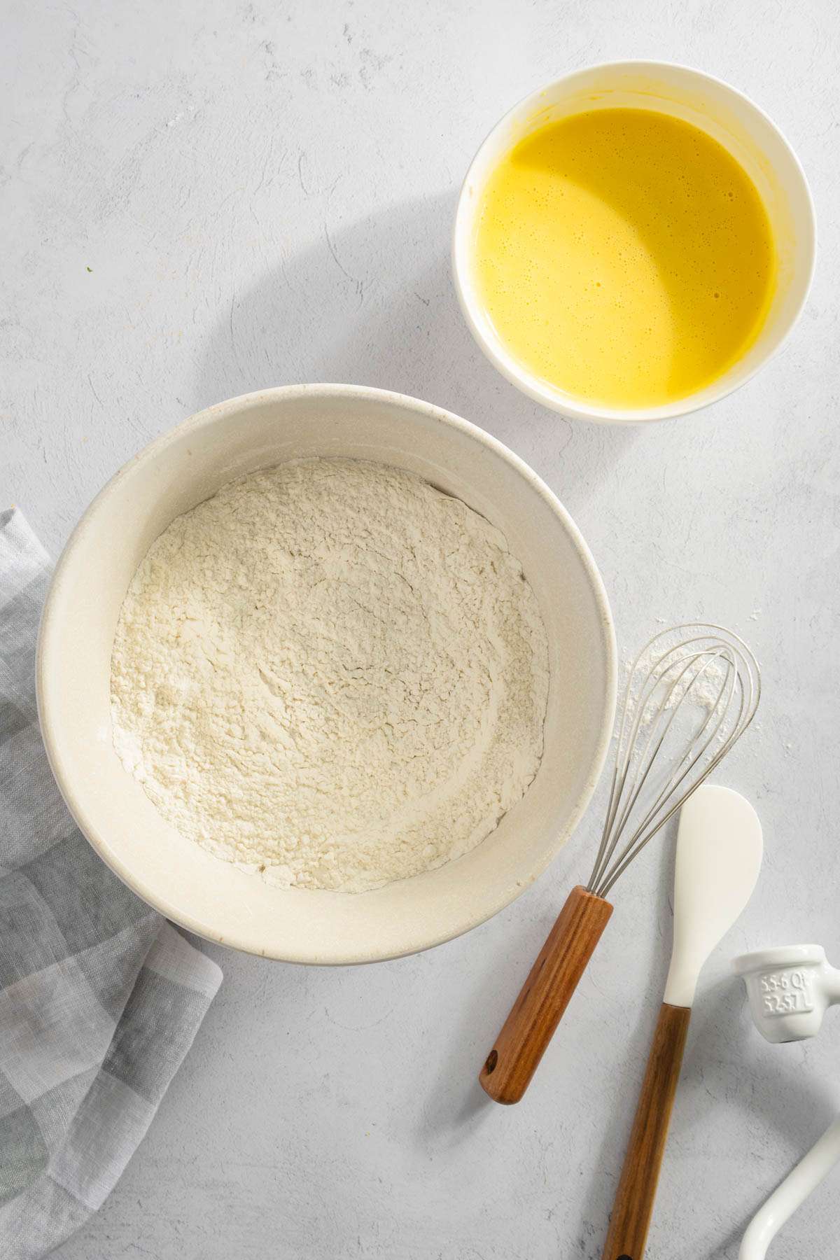 bowl with flour, smaller bowl with egg mixture