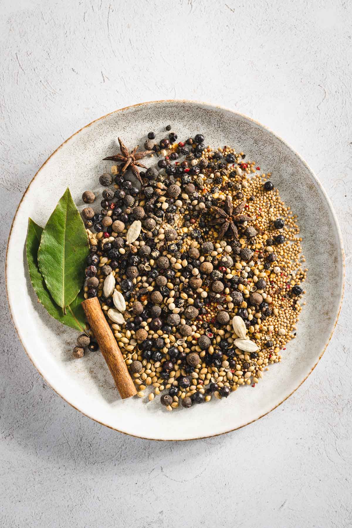 ingredients for Pickling spice on a plate