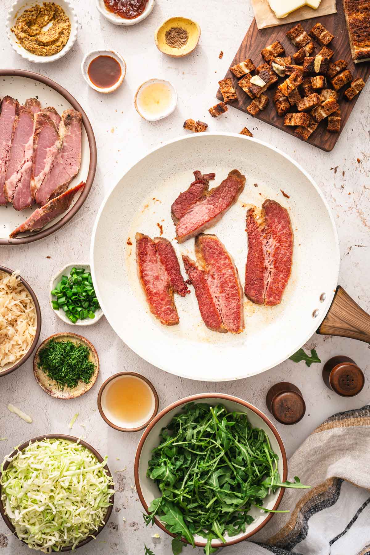 skillet with fried corned beef slices
