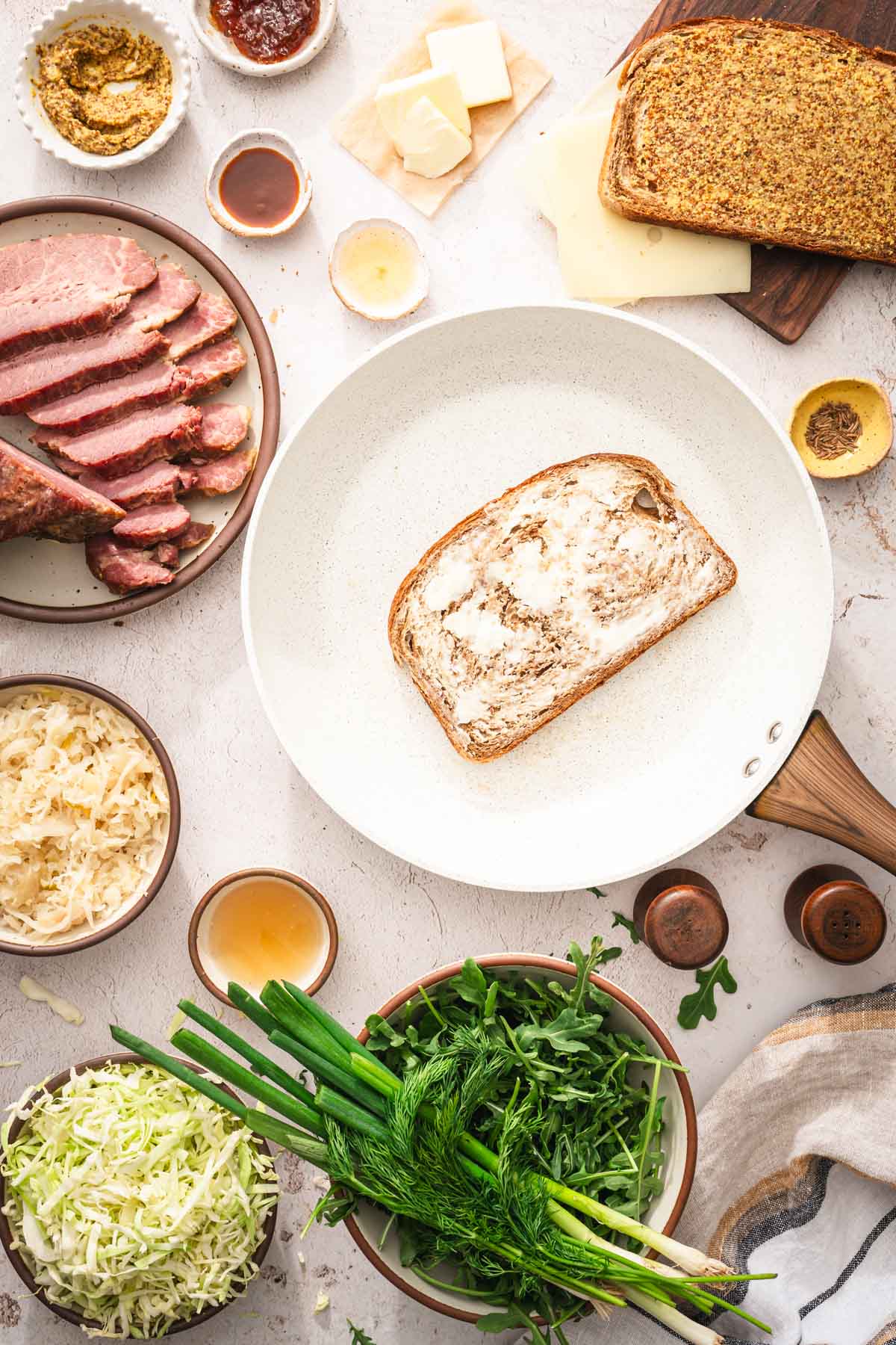 skillet with a buttered slice of bread