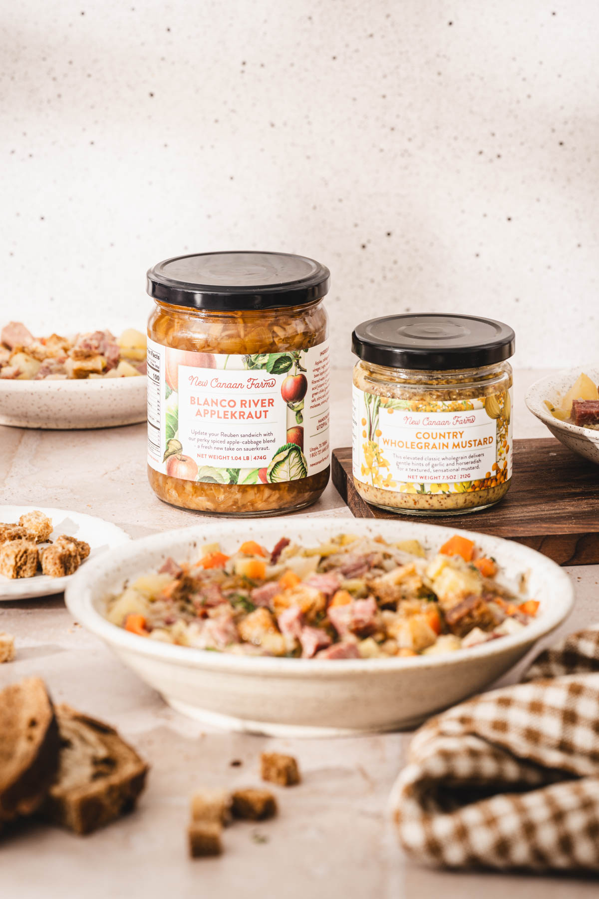 two jars behind a bowl with soup