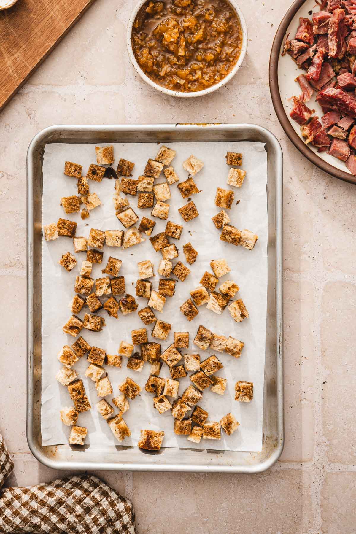 shet pan with croutons before baking