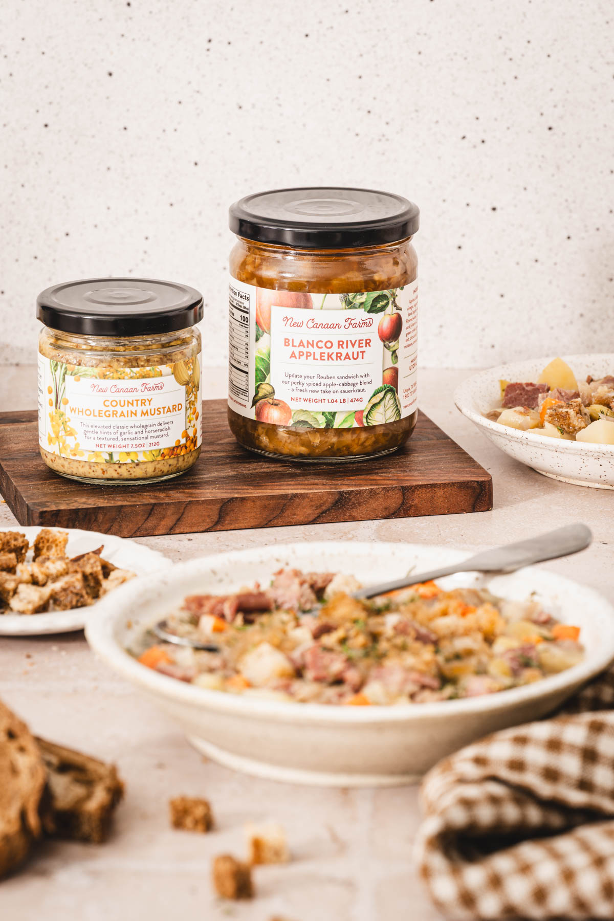 tow jars, bowl with soup, napkin