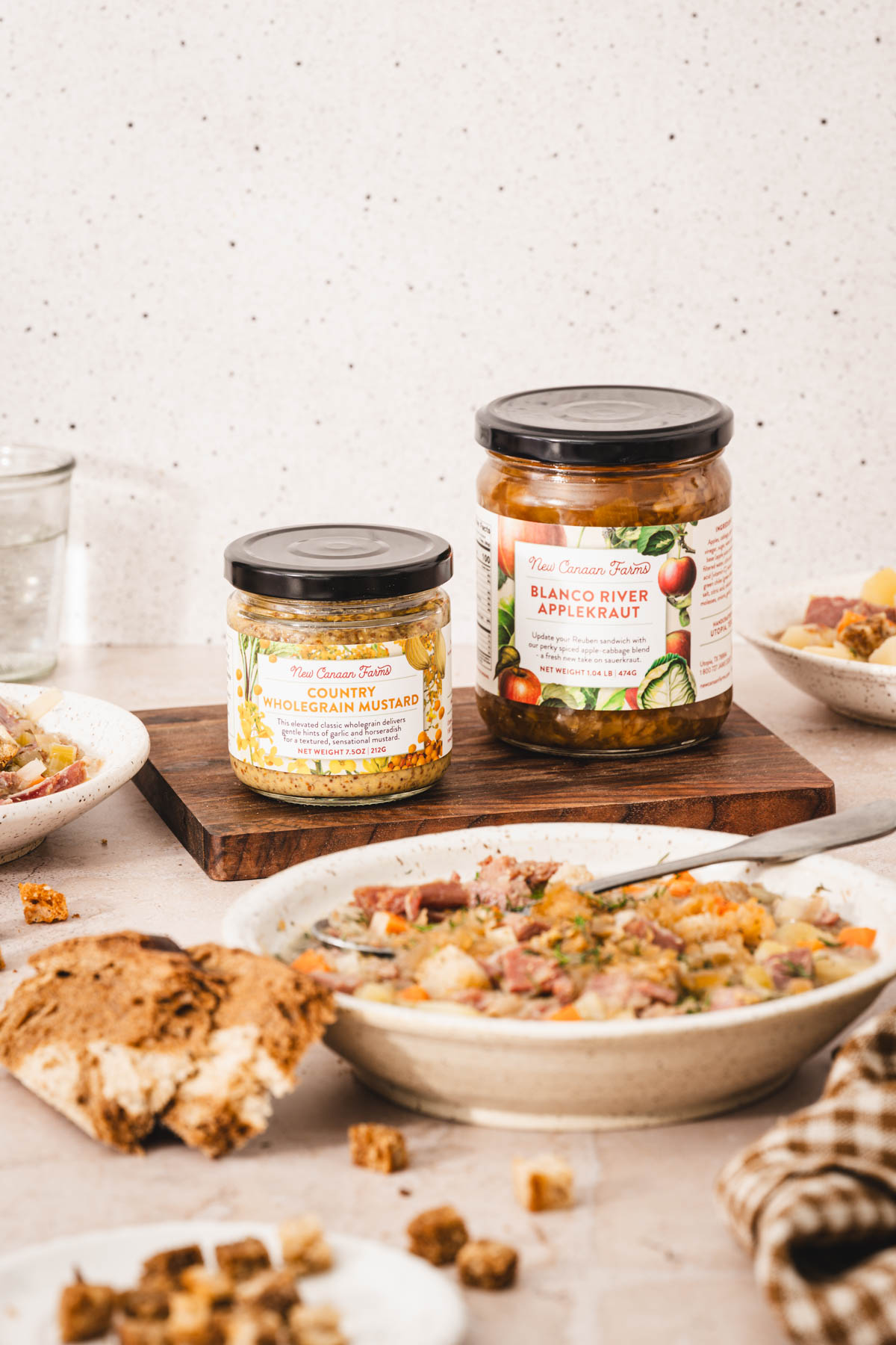 two jars in th background, bowl with soup