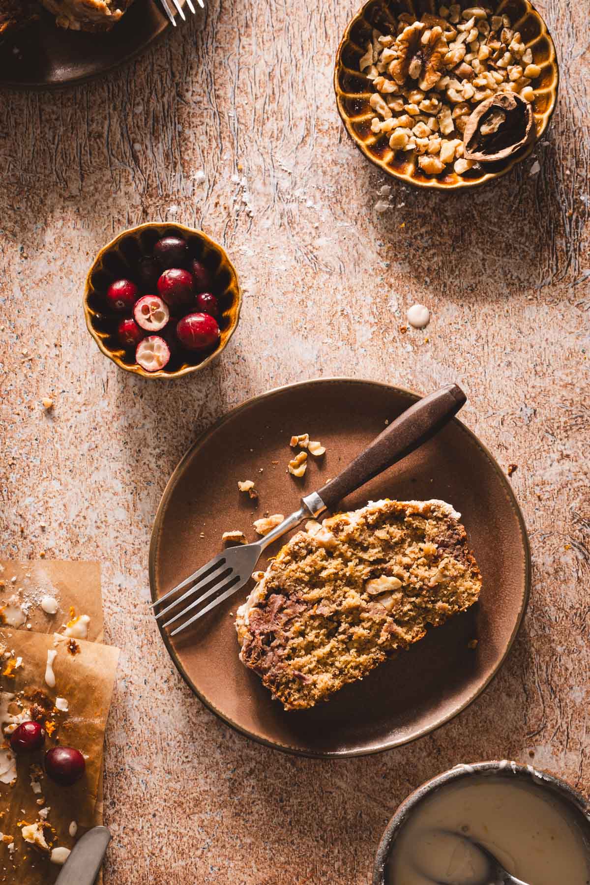slice of cranberry loaf on a serving plate