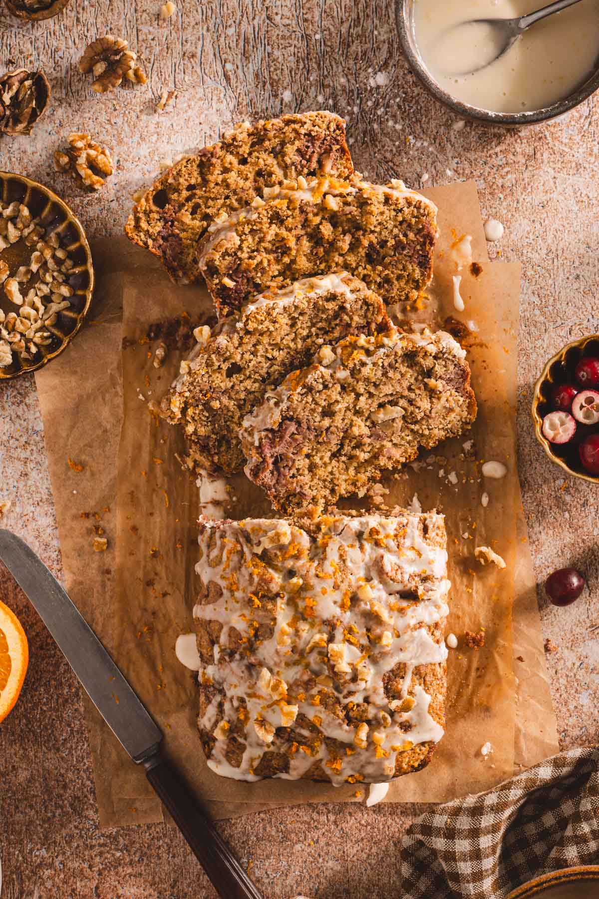 cranberry loaf sliced on a parchment paper