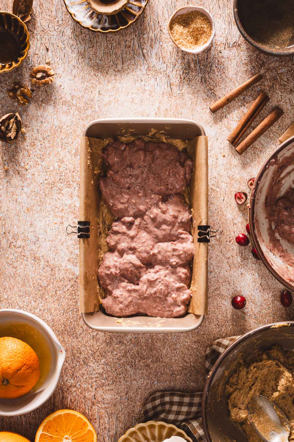 batter mixd with cranberry sauce added into the baking dish