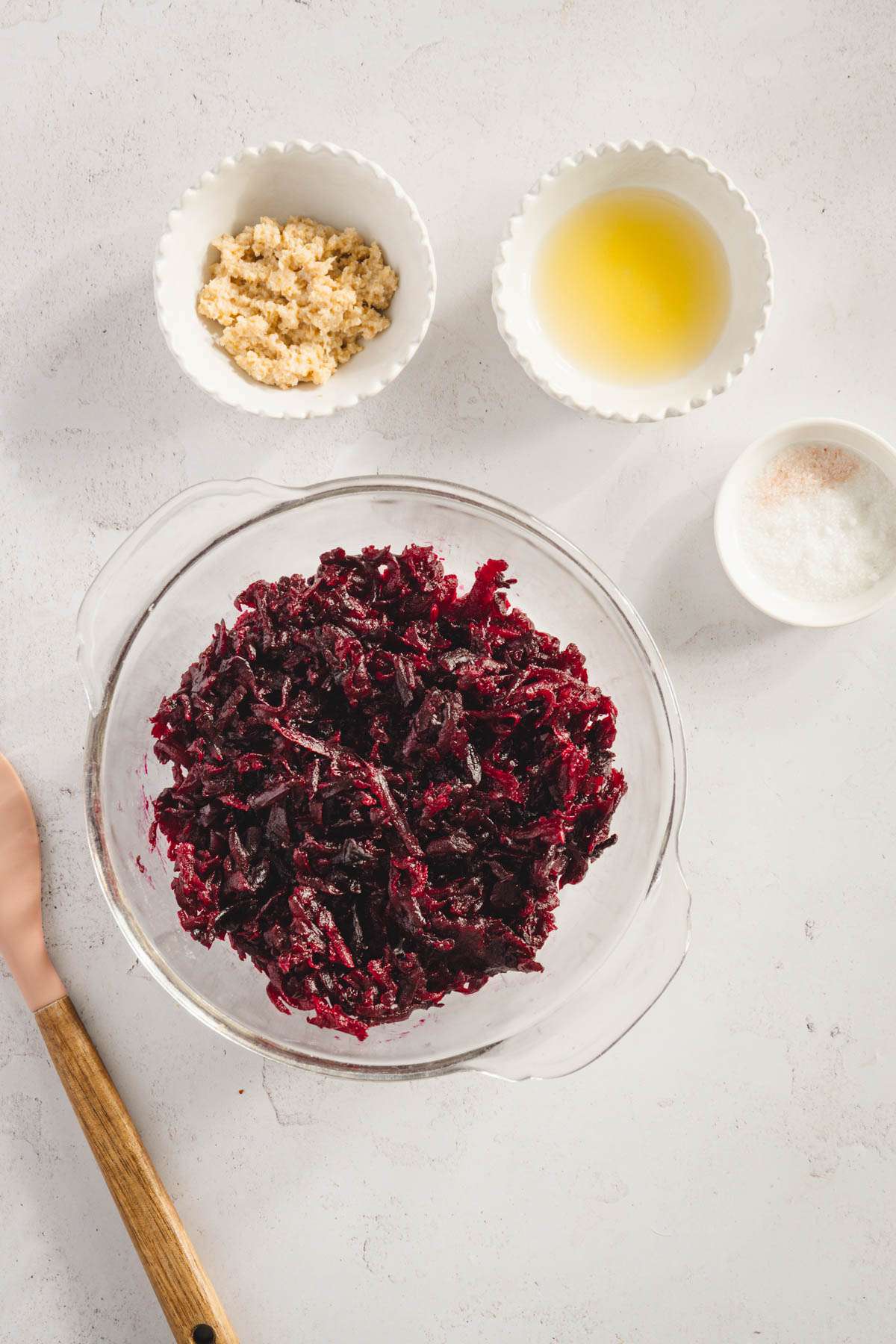 shredded beets in a bowl, other ingredients for cwikla around