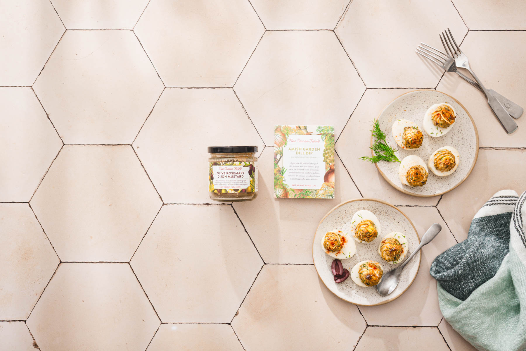 horizontal photo of two serving plates with deviled eggs. NCF products