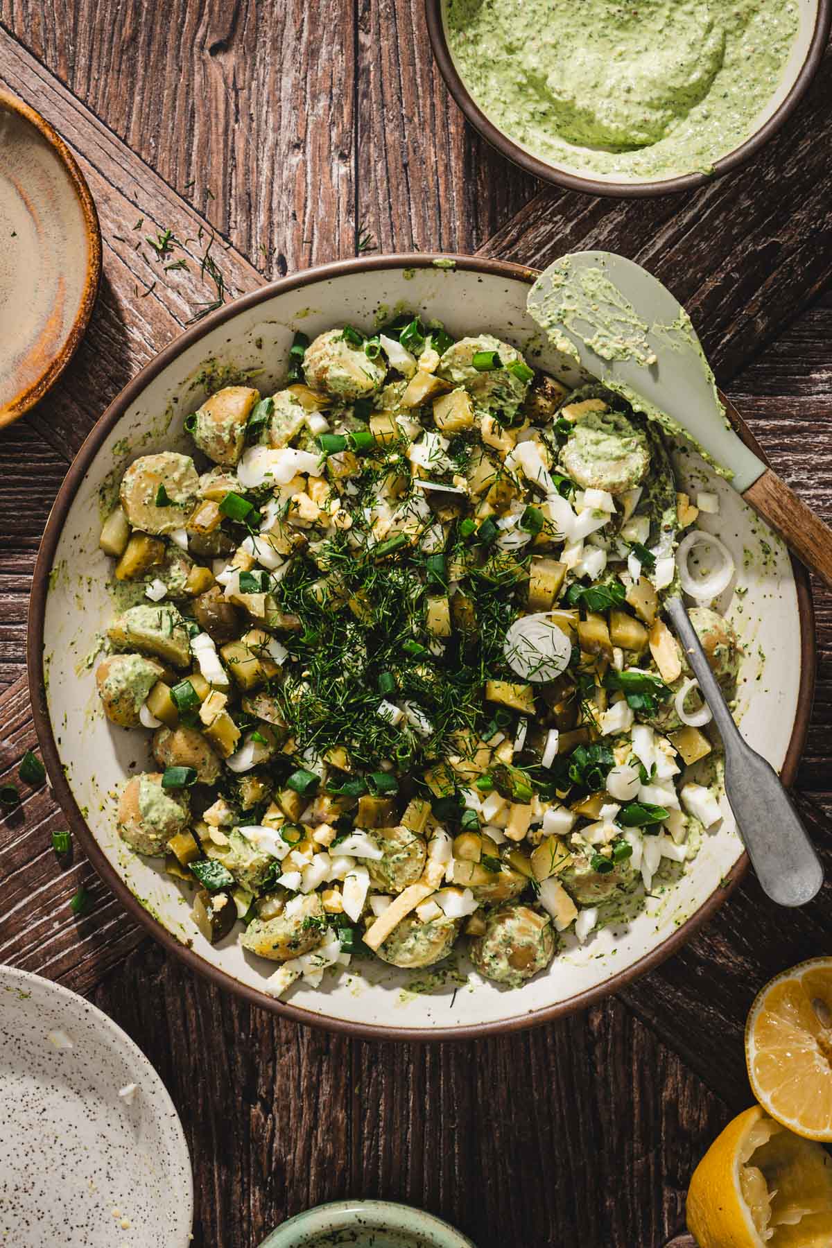 bowl with potatoes and fresh dill and chivews added