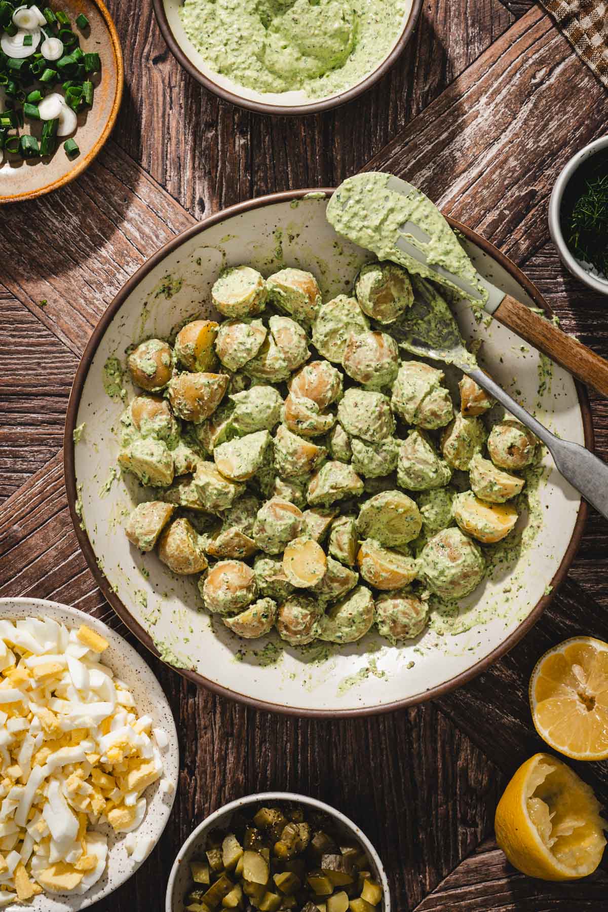 potatoes coated with dill pesto in a large bowl