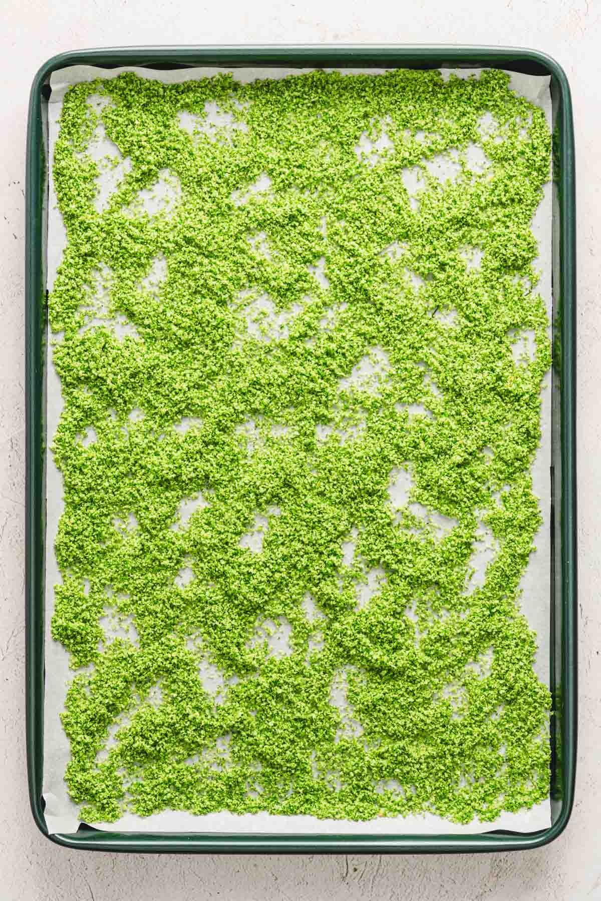 dill salt spread out on a baking sheet