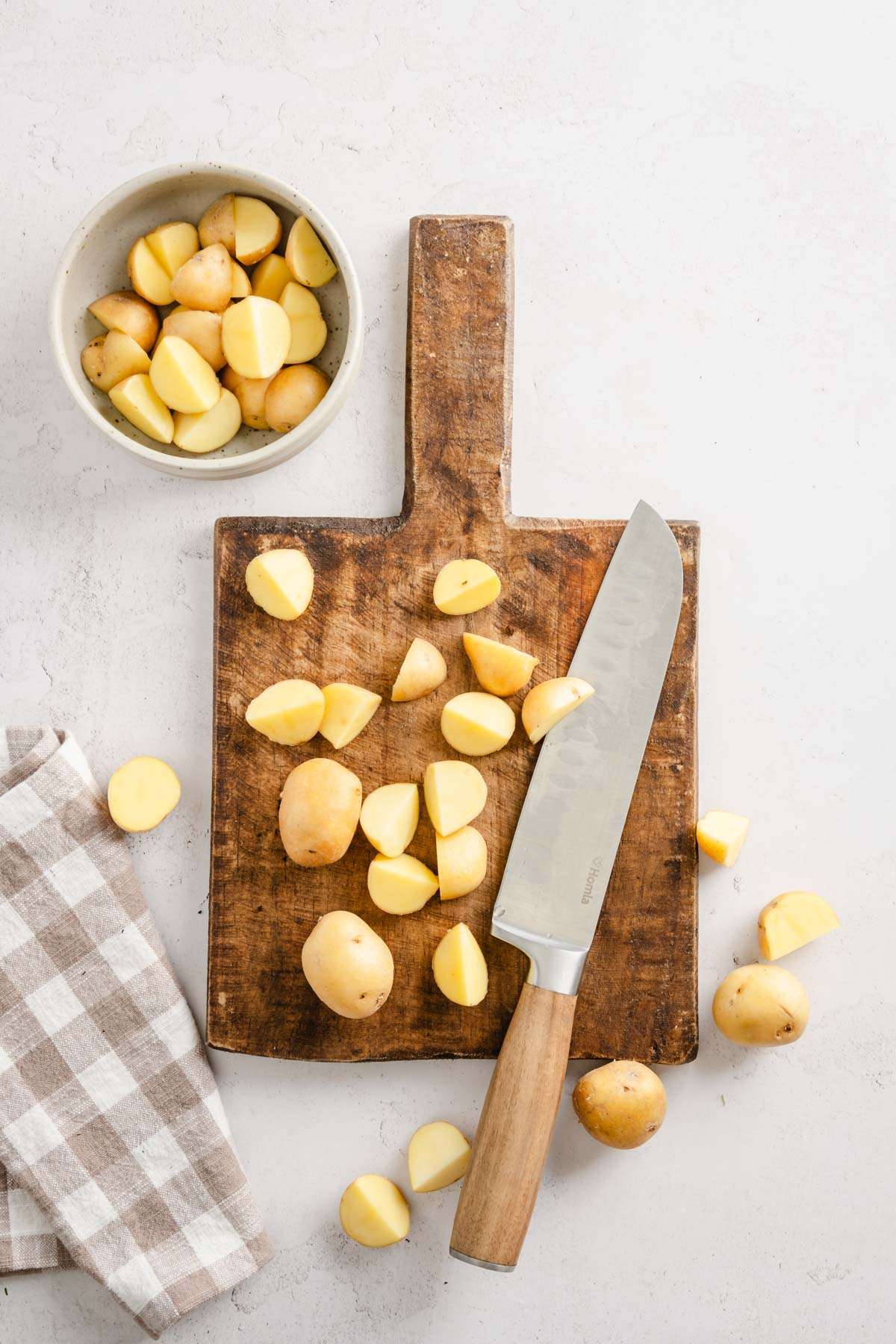 cutting board with chopped potatoes