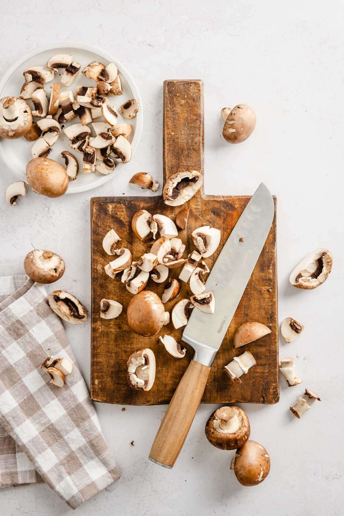 cutting board with mushrooms, knife