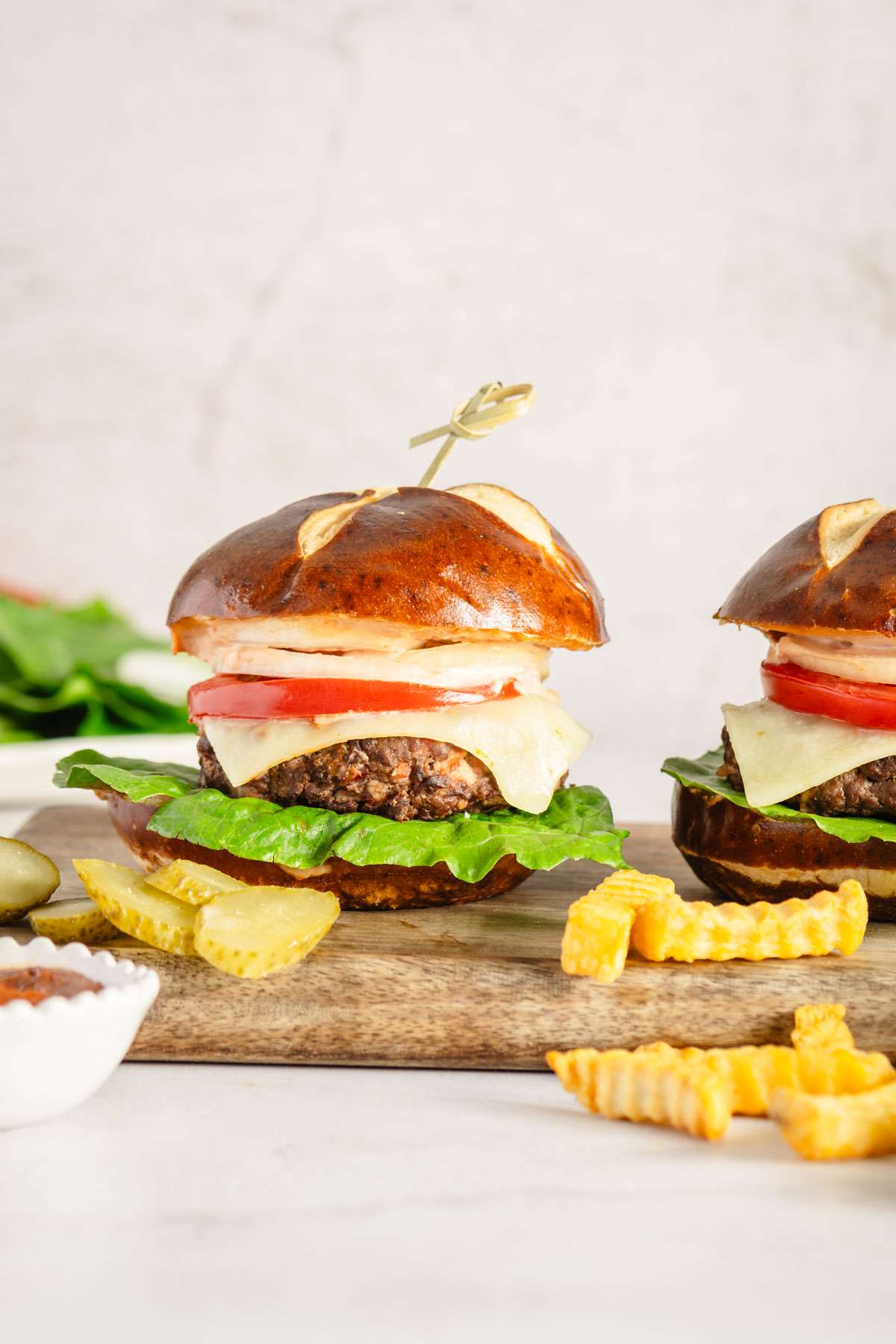 close up of an elk burger on a wooden cutting board