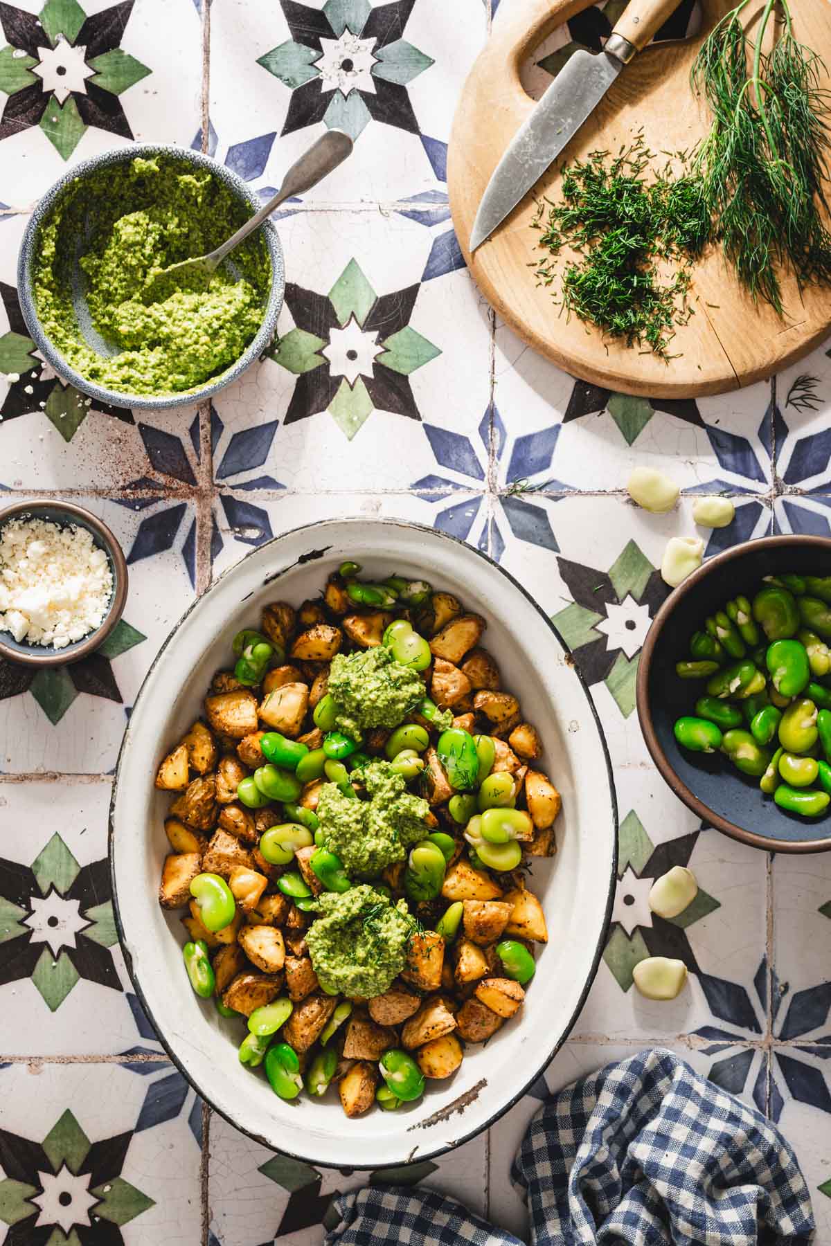 dill pesto and fava beans added to the dish with potatoes