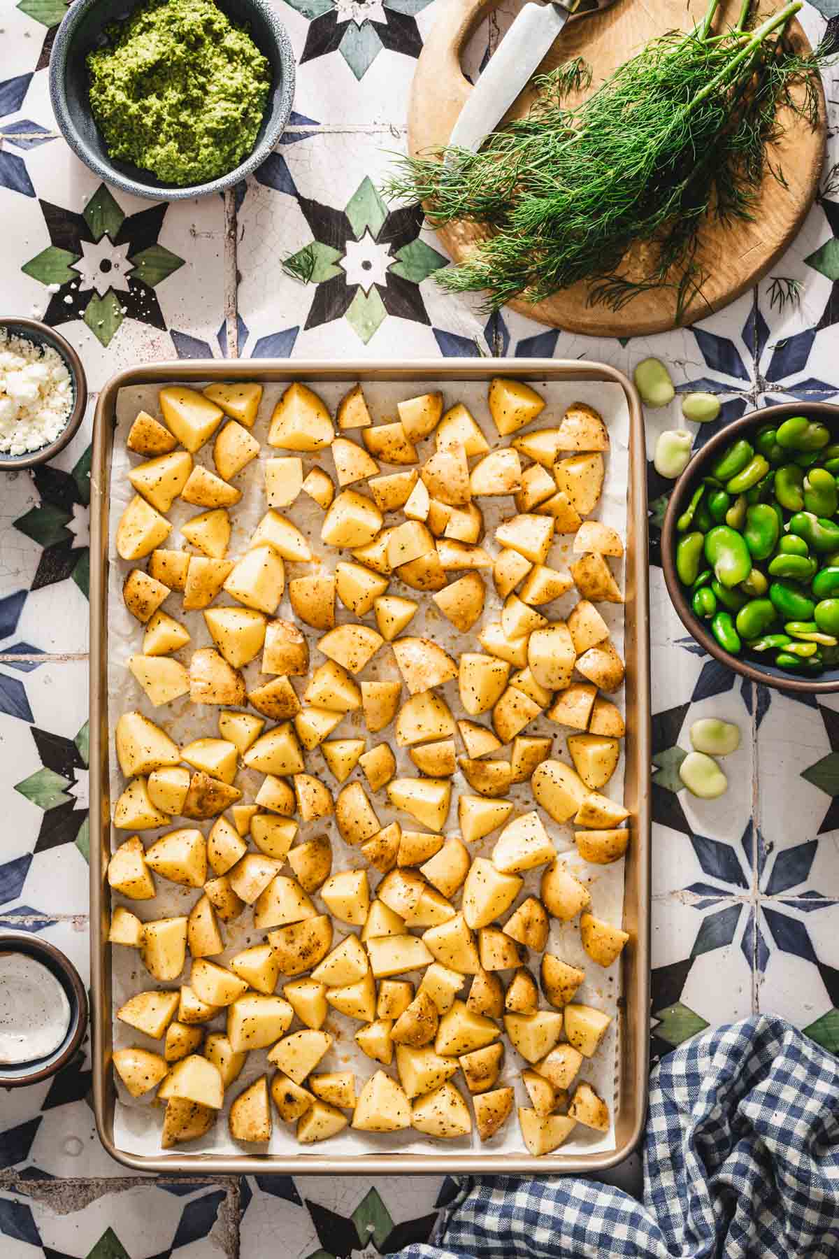 seasoned potatoes on a baking sheet