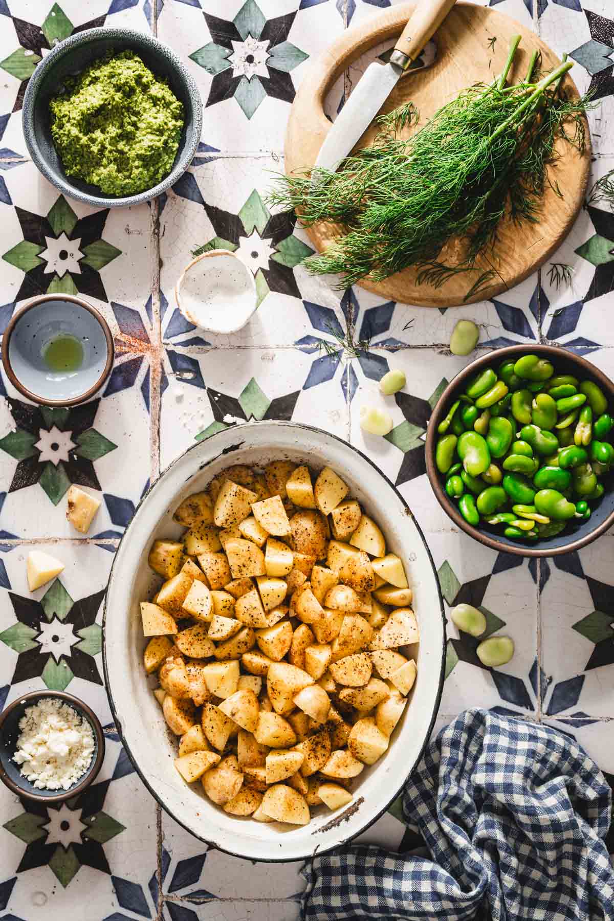 season potatoes in a deep holding dish