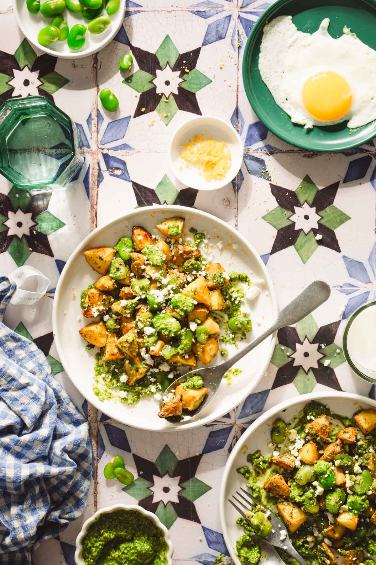 two plates with the fava bean salad