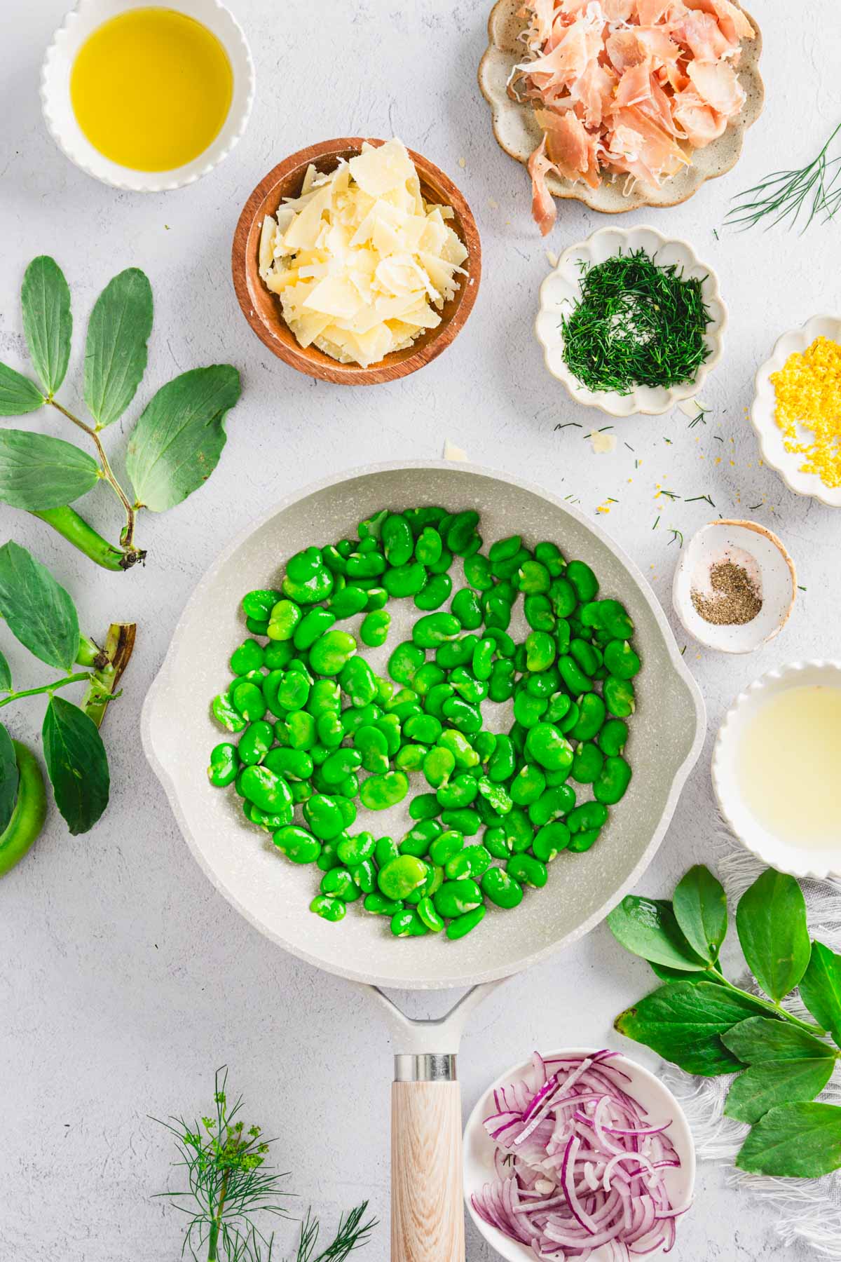 fava beans added to the skillet with butter