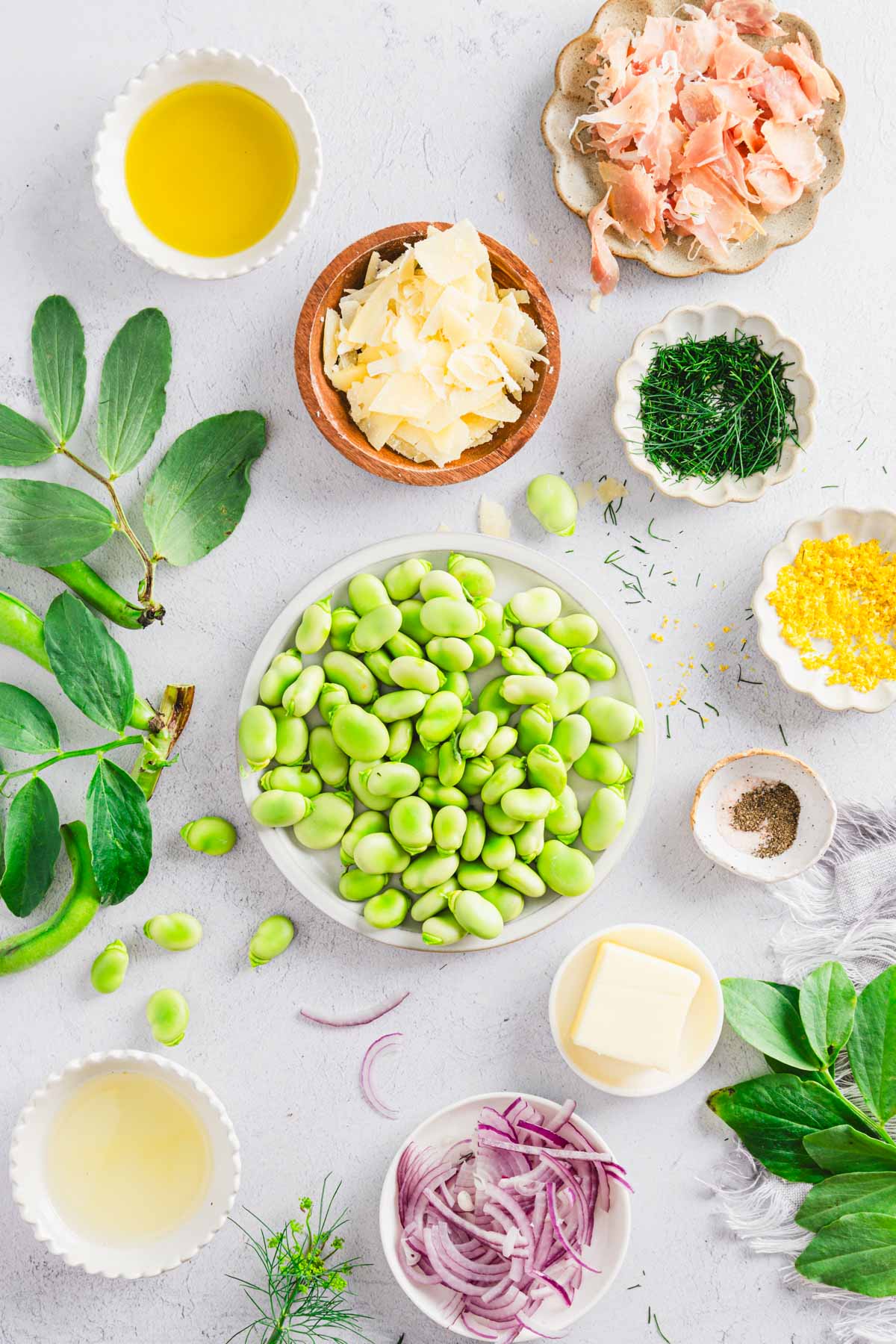 plate with blanched fava beans, other ingredients to make the salad around