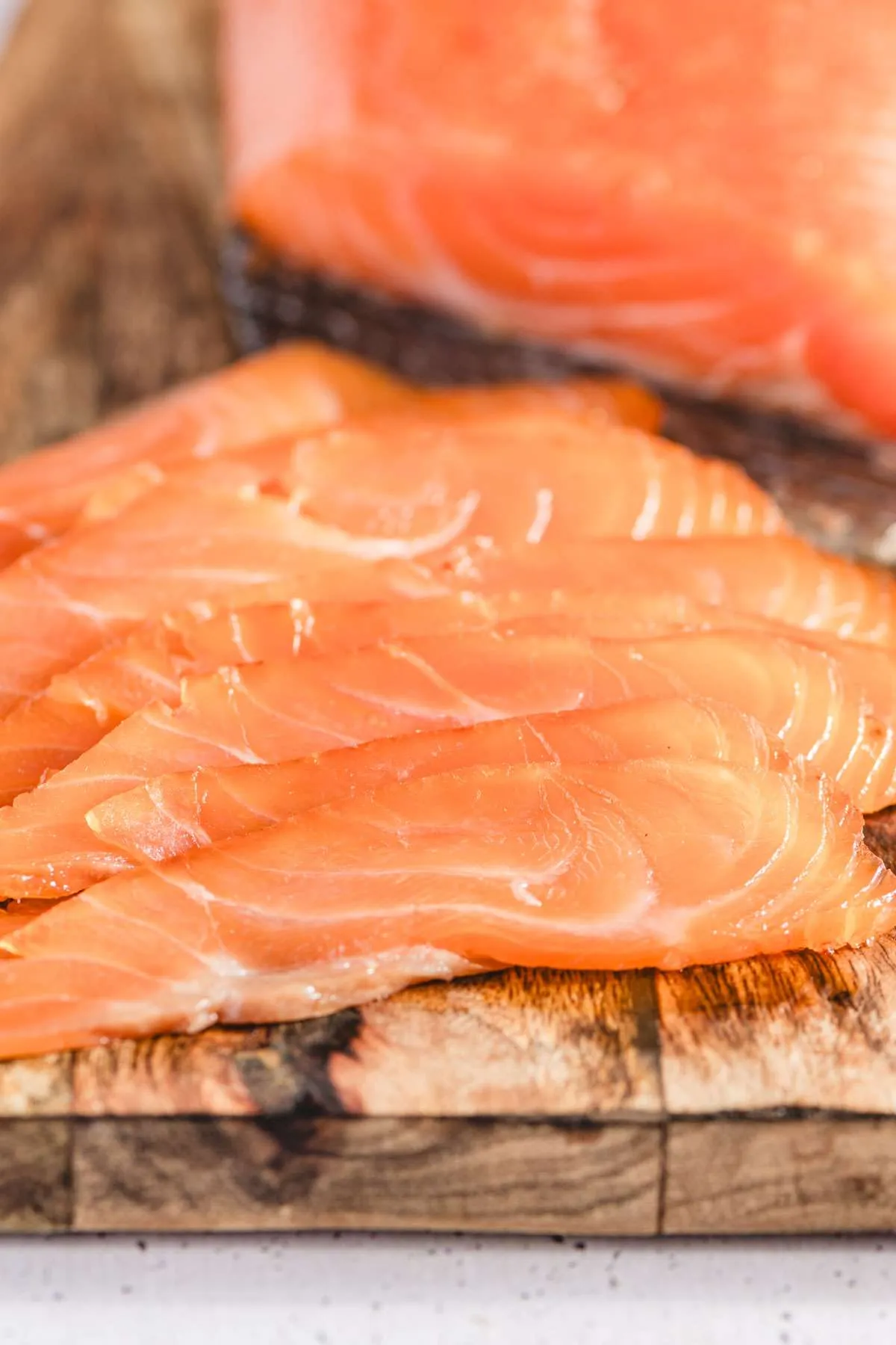 slices of gravlax on a cutting board