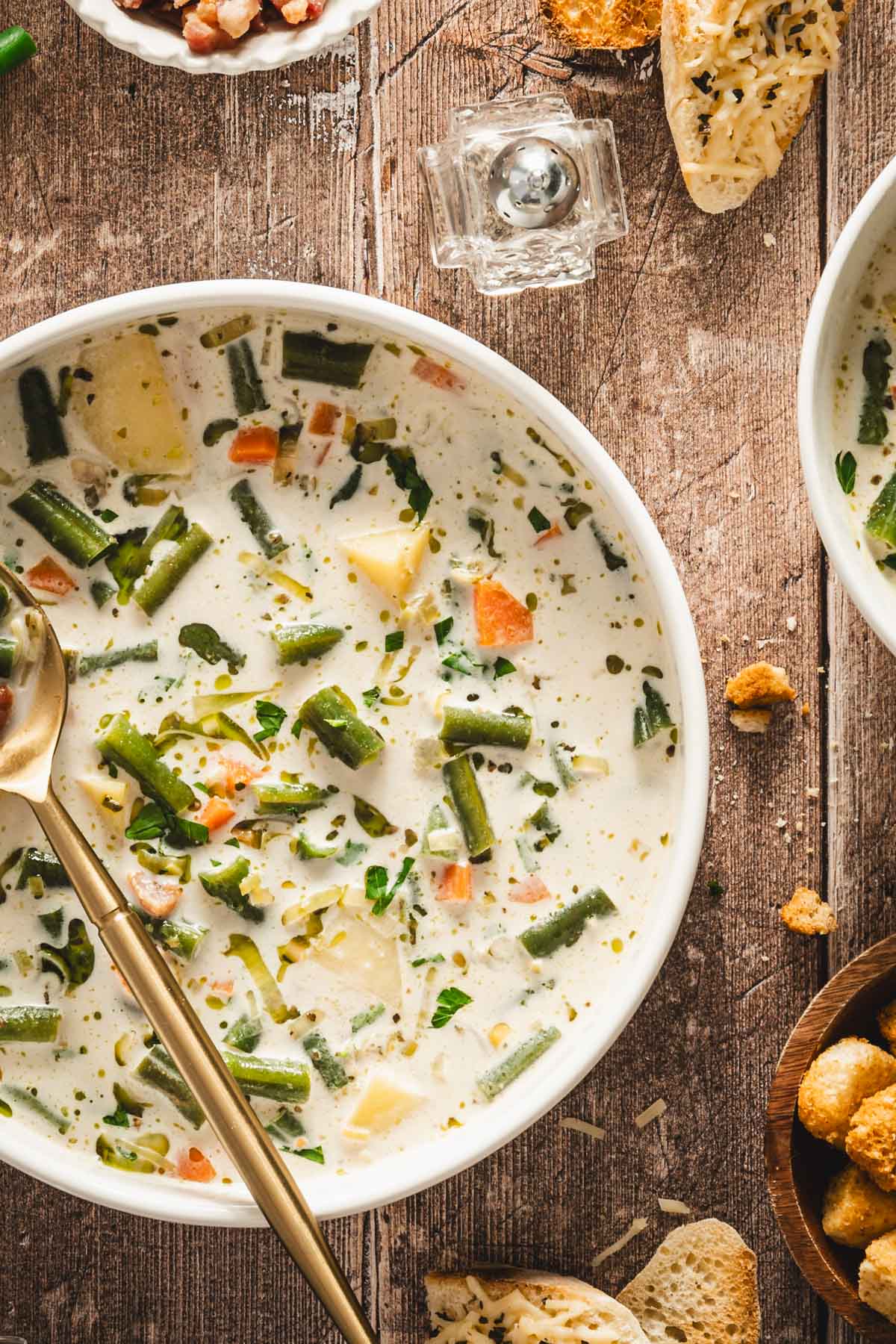 serving bowl with green bean soup, close up