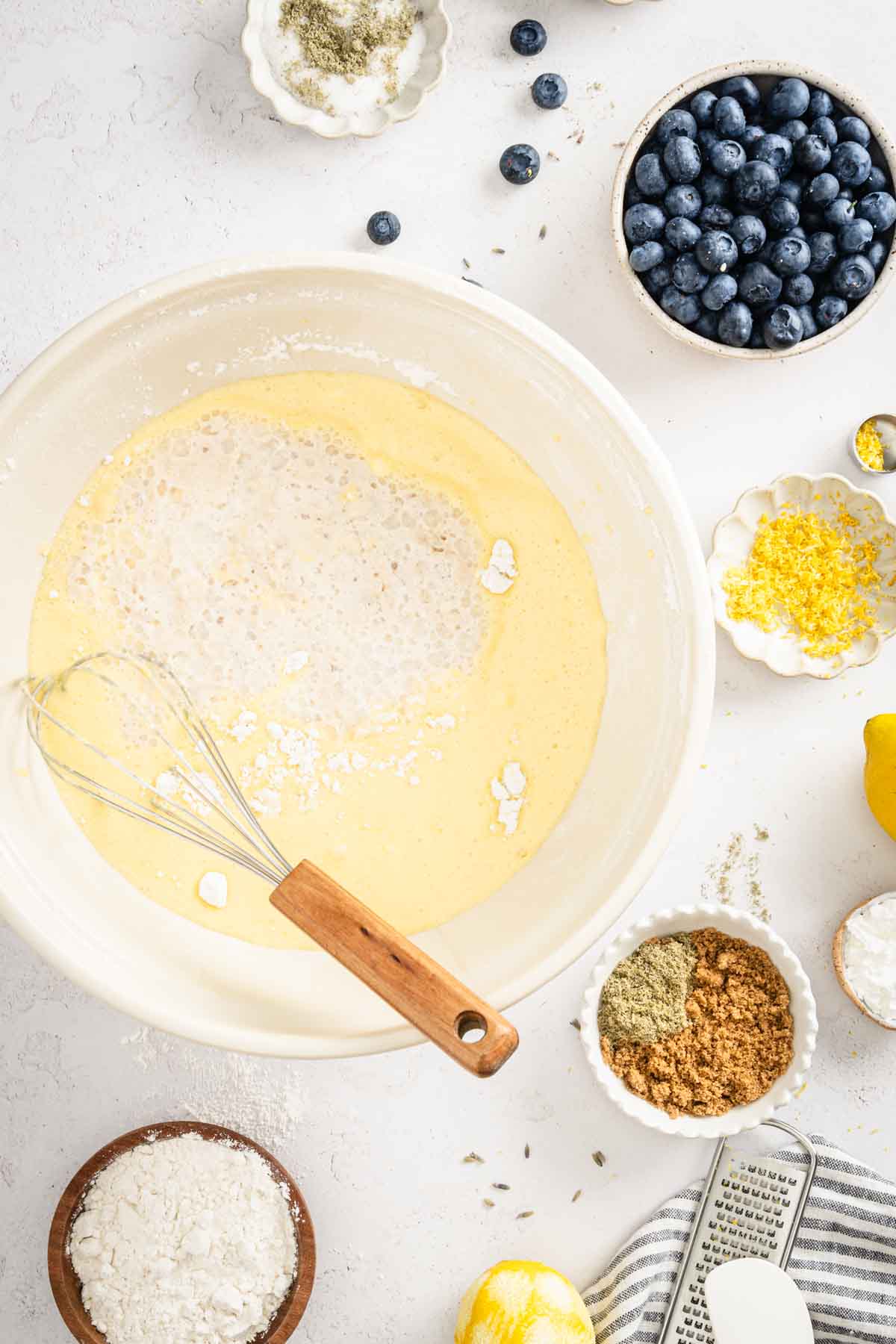 large mixing bowl with dry and wet ingredients mixed in