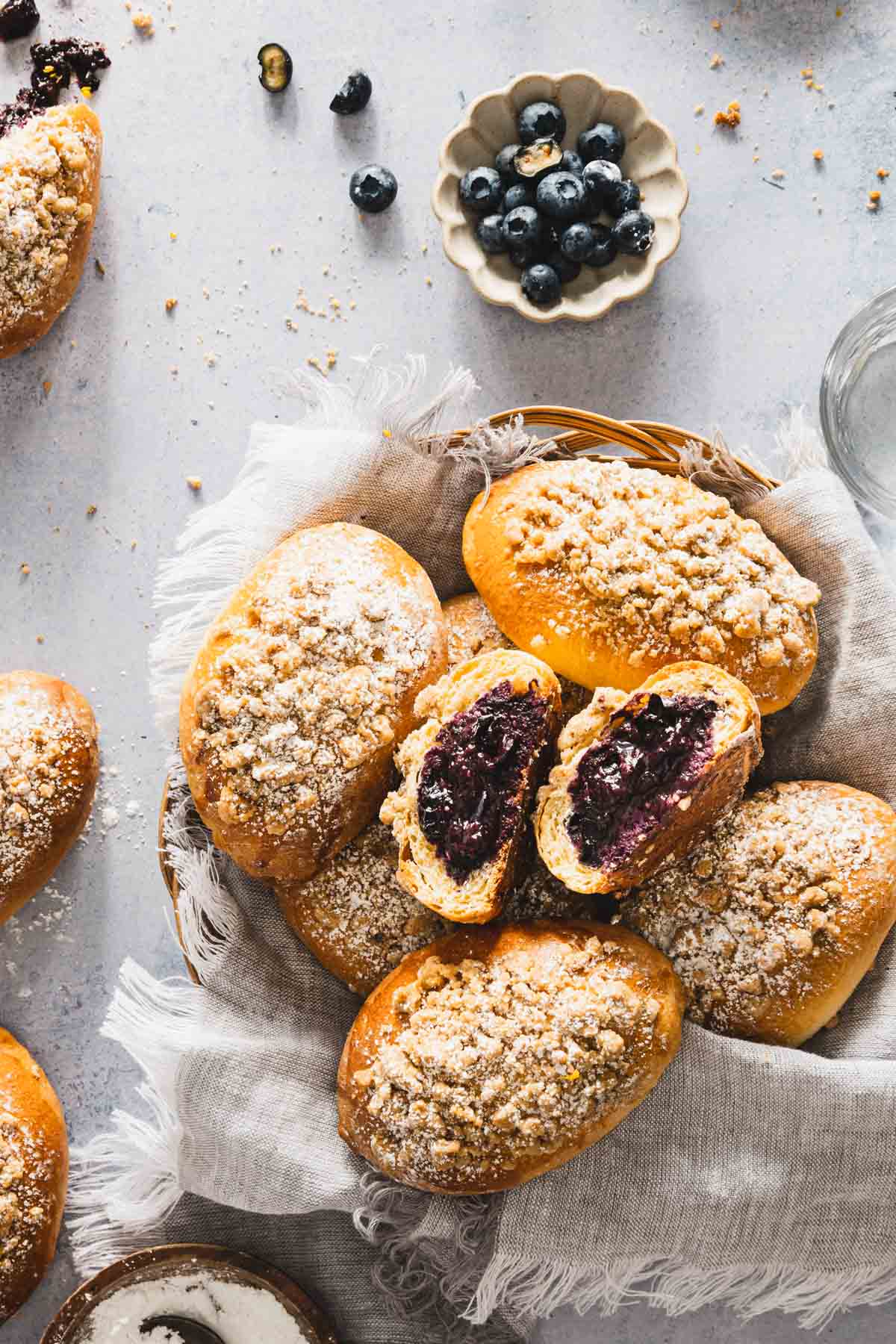 jagodzianki in a basket, dish with fresh blueberries and powdered sugar