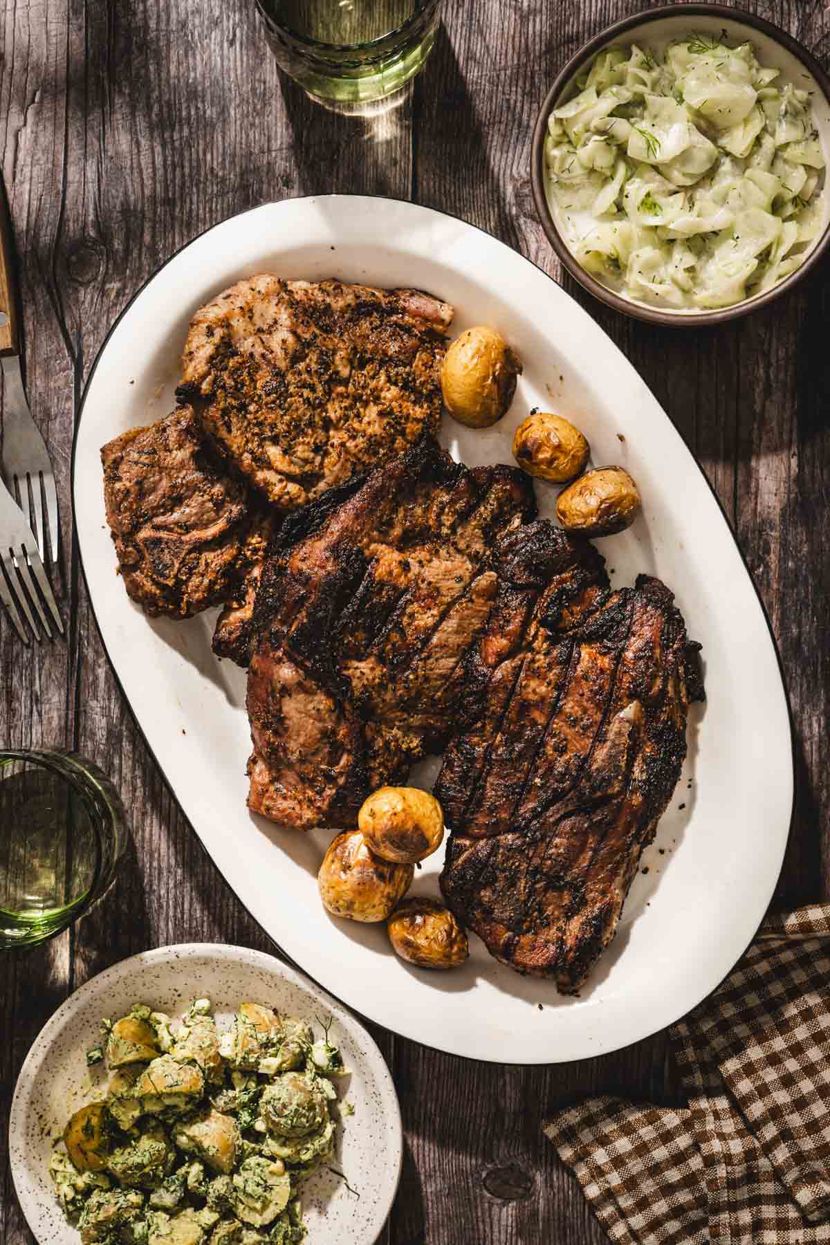 grillled karkowka w mizeria and potato salad
