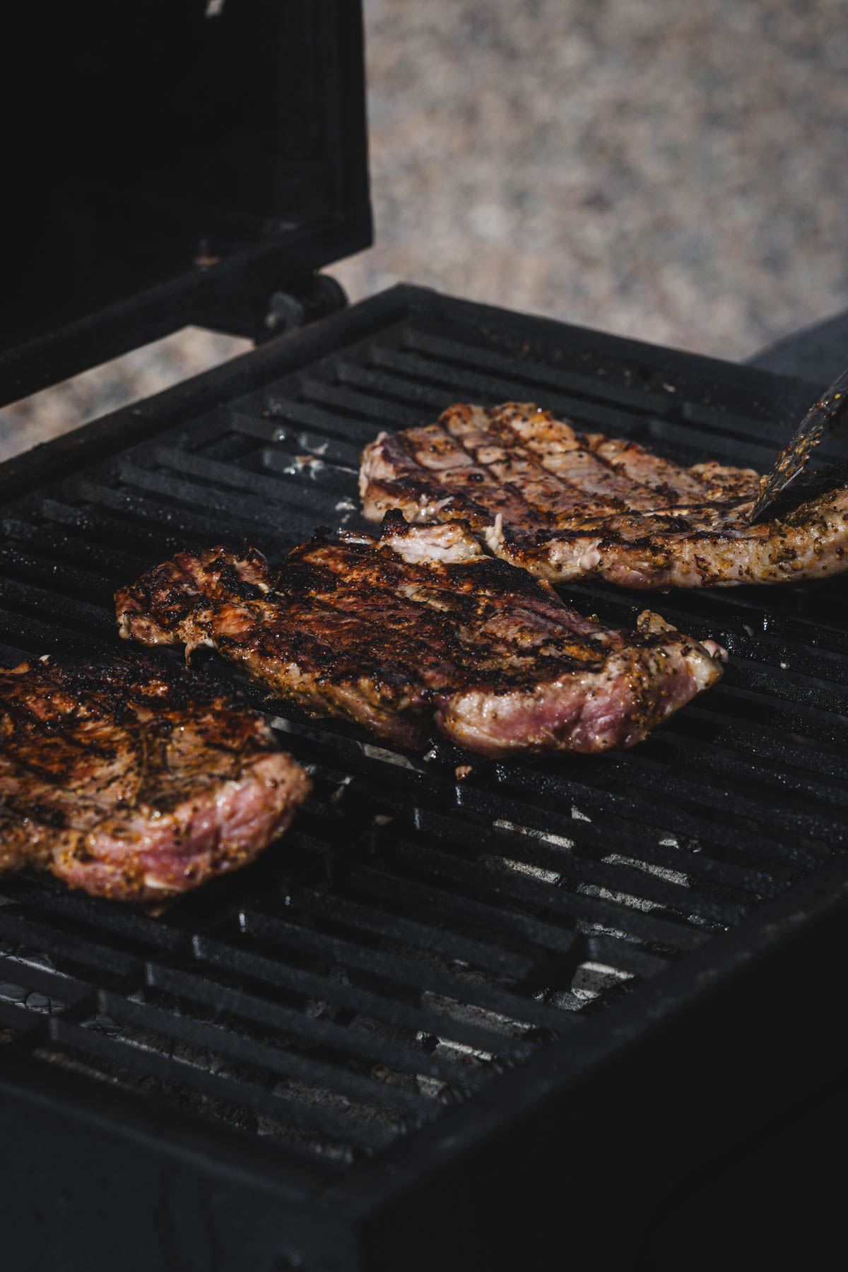 pieces of meat on the grill grates