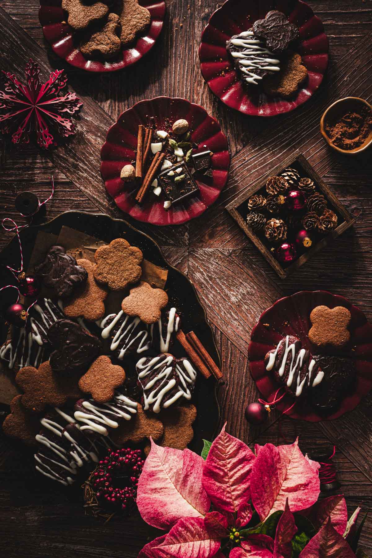 pierniczki on a serving platter,various plates, christmas decorations, poinsettia plant