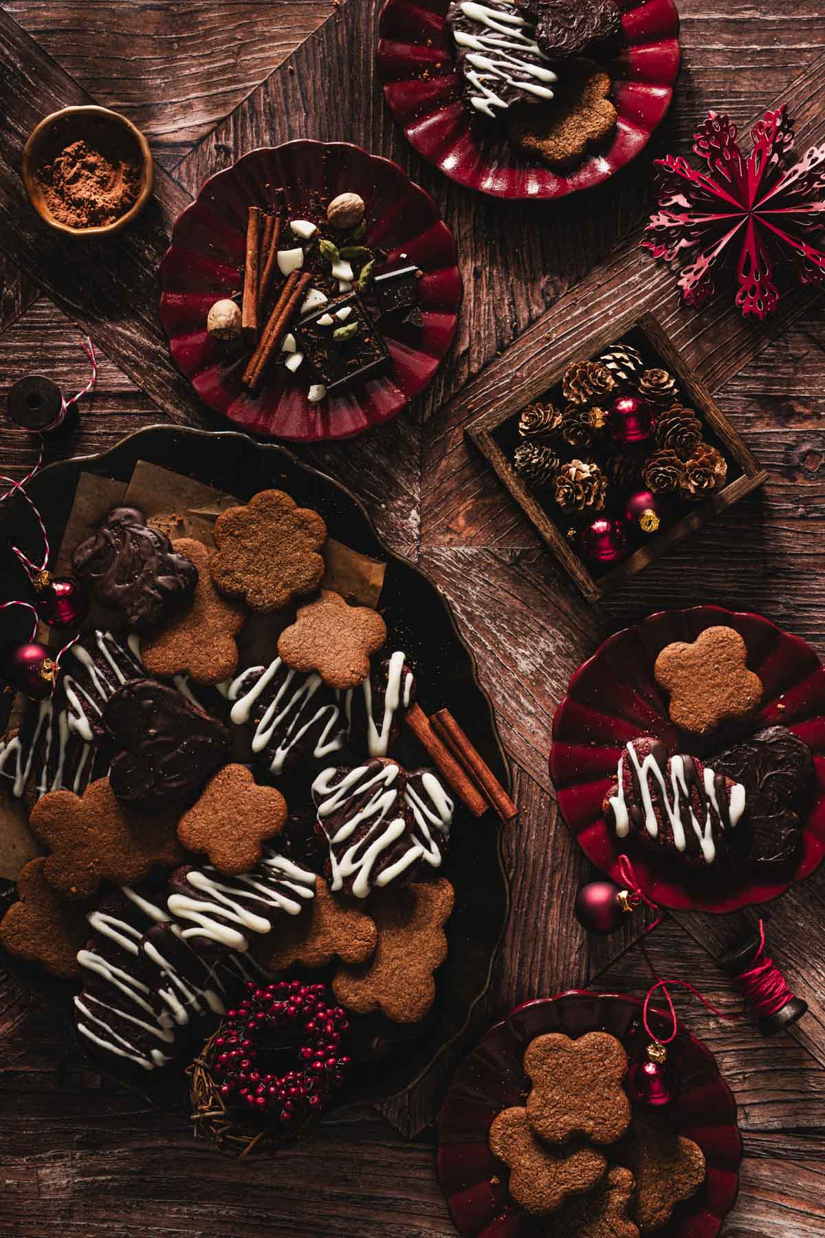 pierniczki on a serving platter,various plates, christmas decorations