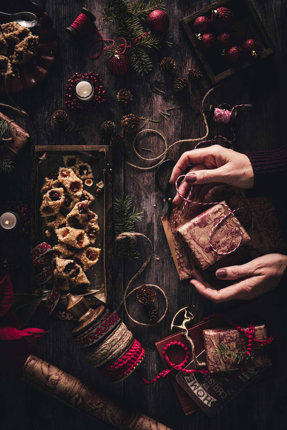 hands in frmae holding a wrapped, gift box